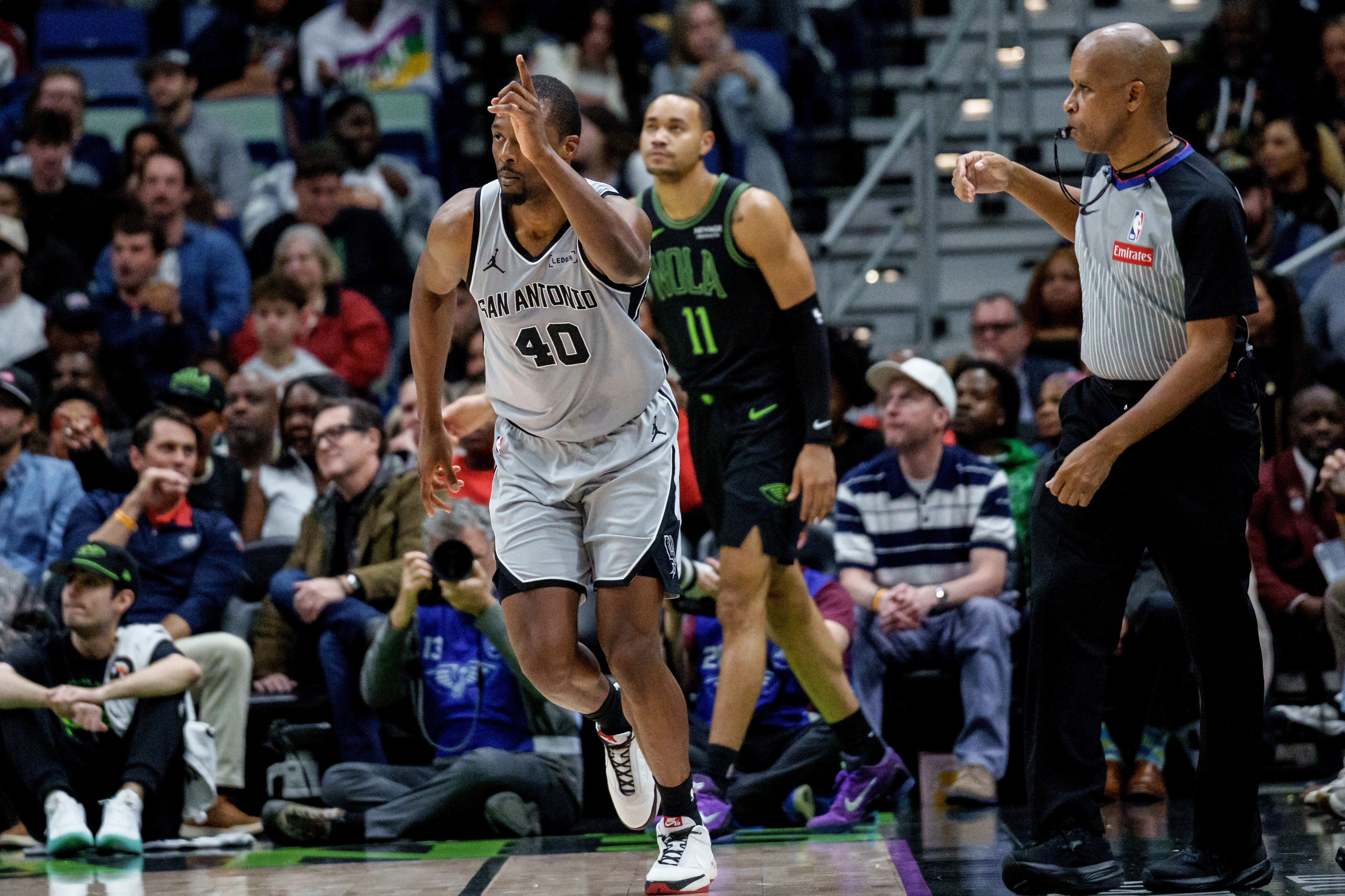 Spurs spoil Queen's first triple-double and hold on to beat the