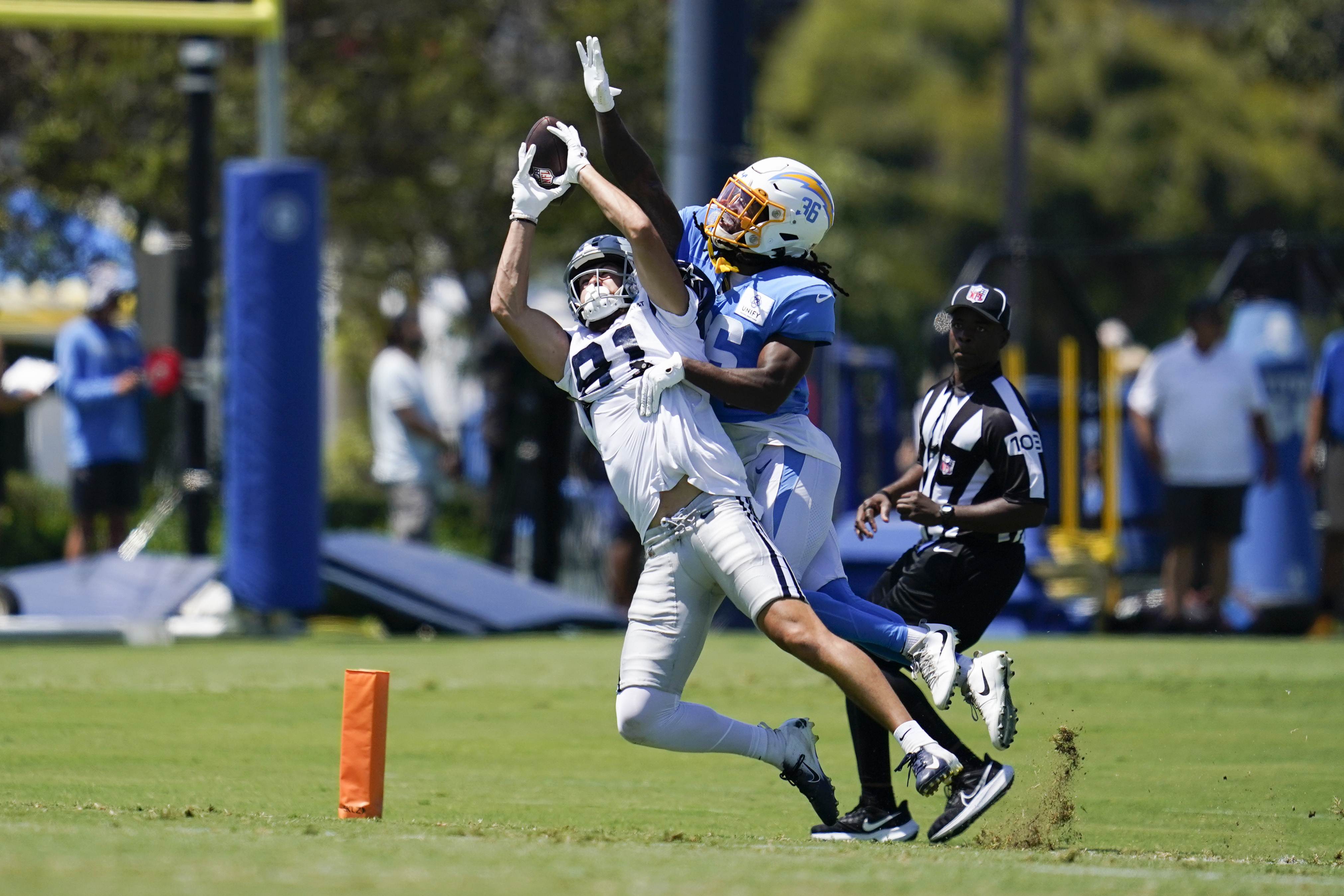 Los Angeles Rams wide receiver Tyler Johnson (14) reaches for the pass  while being held by Los Angeles Chargers cornerback AJ Uzodinma (35) in a  NFL preseason game. The Chargers defeated the