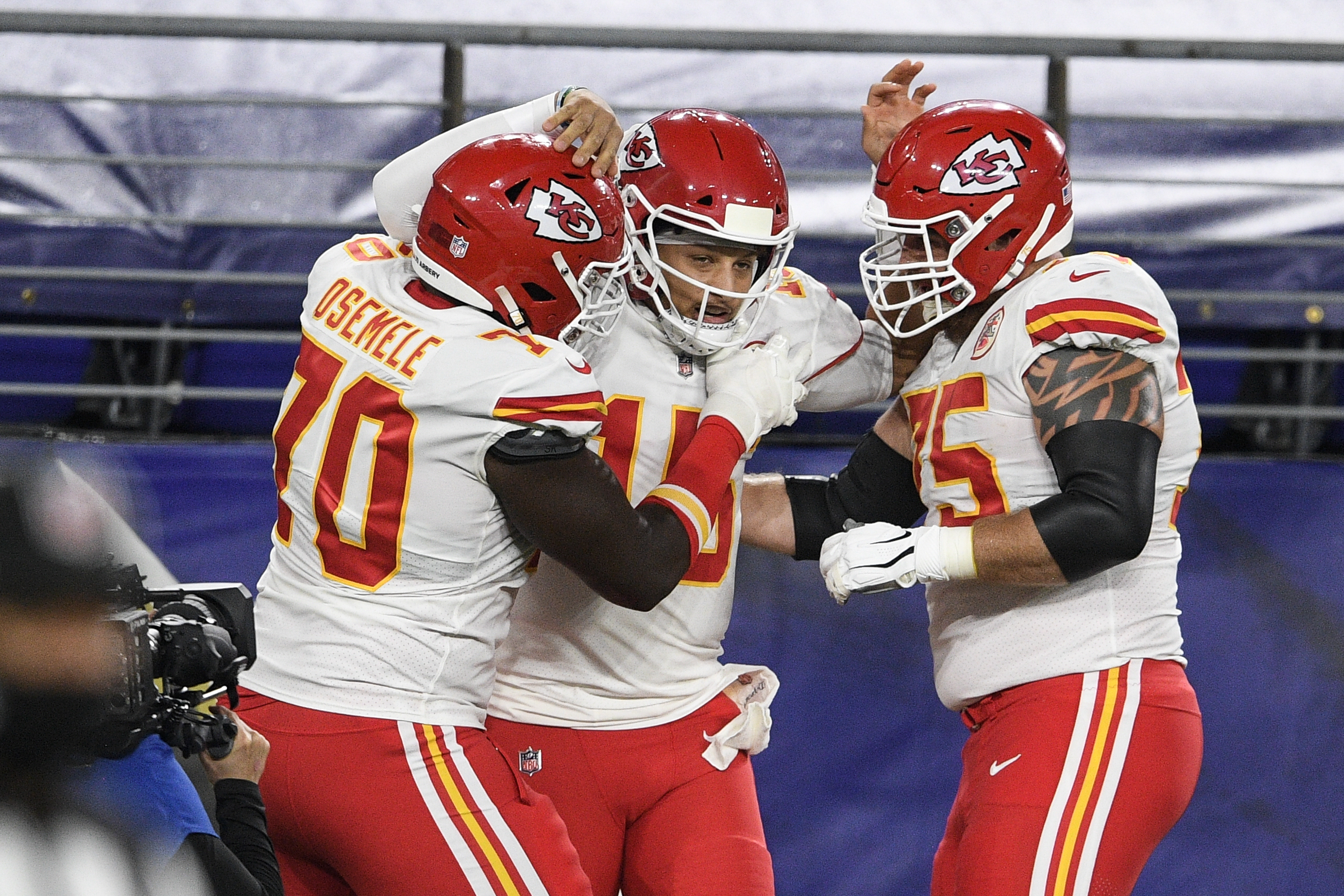 KANSAS CITY, MO - OCTOBER 10: Kansas City Chiefs quarterback Patrick  Mahomes (15) rolls out in the first quarter of an NFL football game between  the Buffalo Bills and Kansas City Chiefs