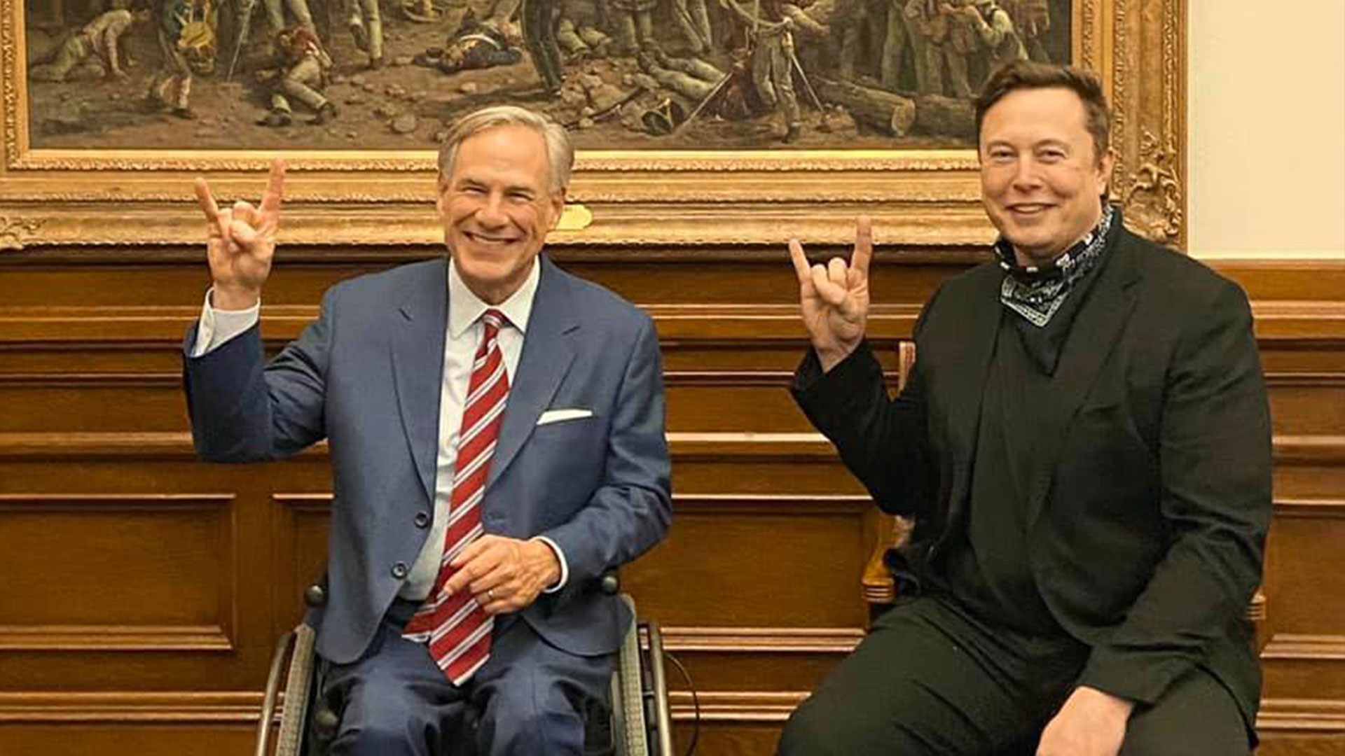 Gov. Greg Abbott and Elon Musk pose with uniquely Texas hand gesture