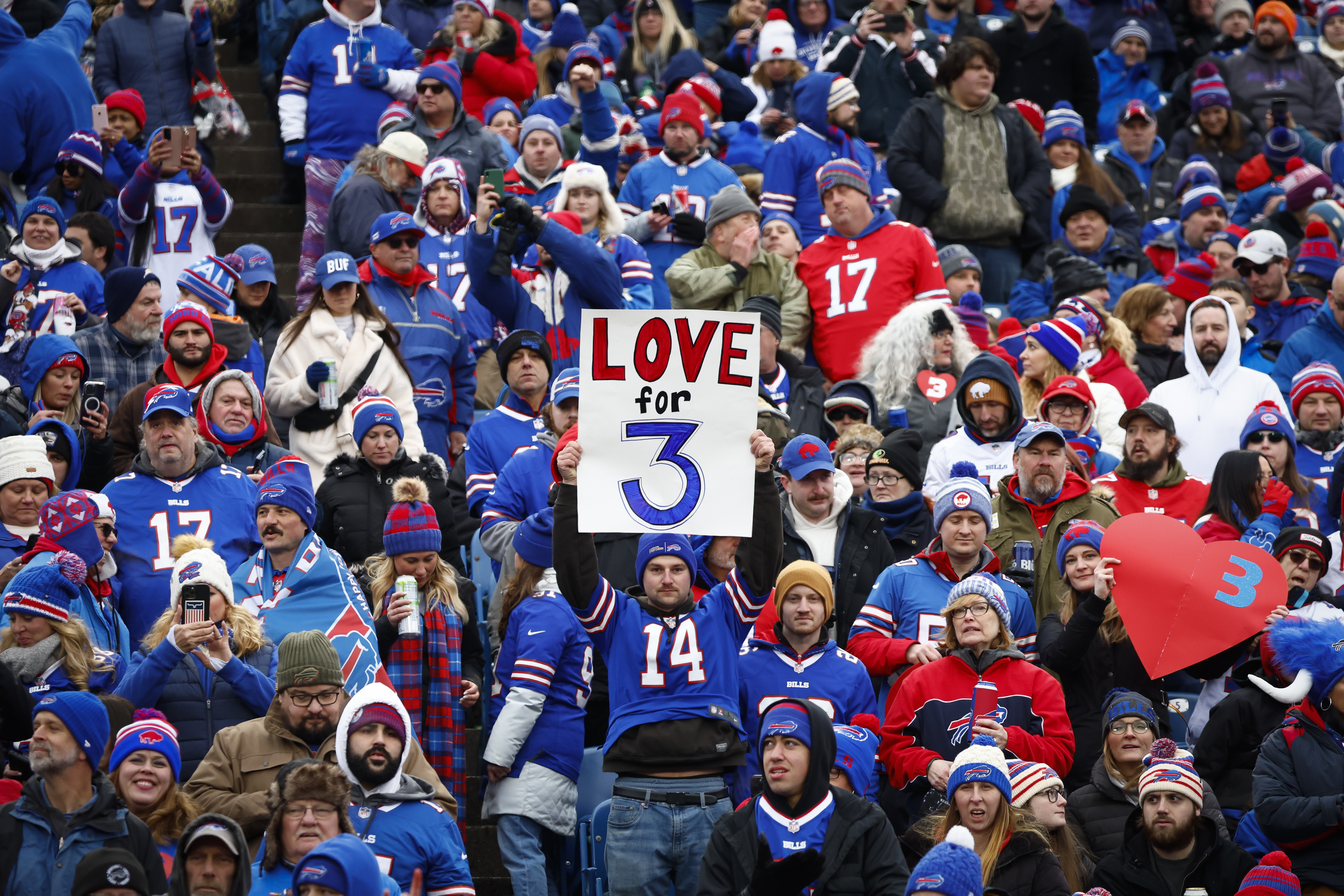 Buffalo Bills safety Damar Hamlin is visited by Rodney Thomas II