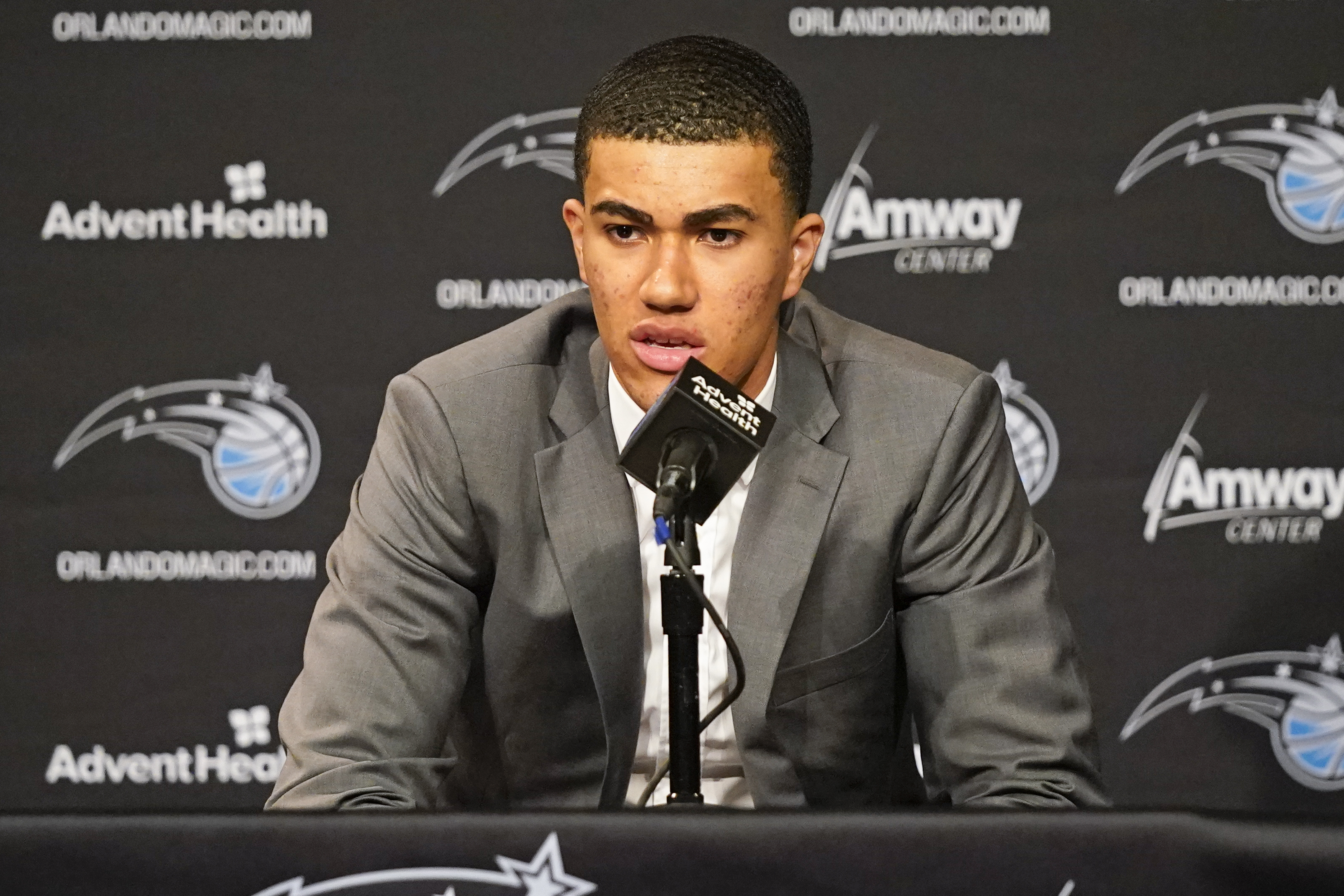 Orlando Magic draft picks forward Caleb Houstan (2) and forward Paolo  Banchero (5) show off their new jerseys during a news conference for the  NBA basketball team, Friday, June 24, 2022, in