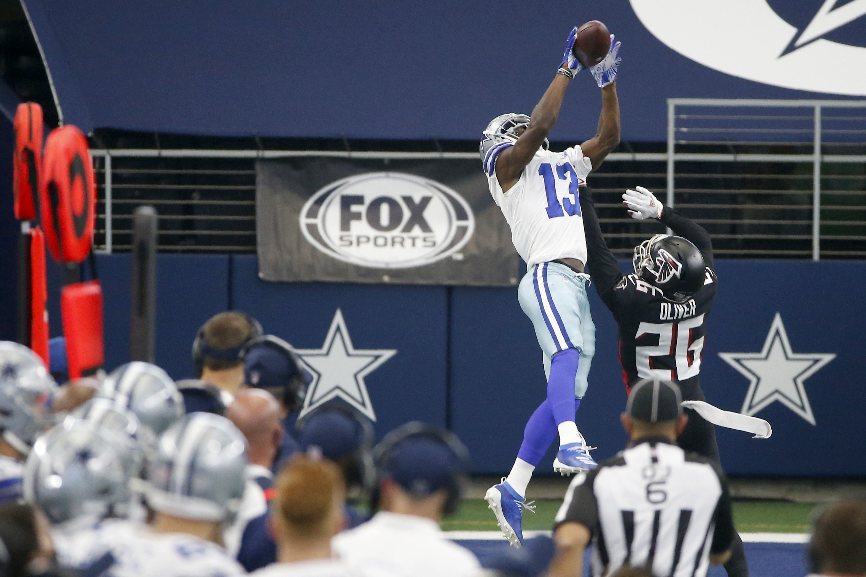 Dallas Cowboys safety Donovan Wilson (37) stops Arizona Cardinals  quarterback Kyler Murray (1) as he carries the ball in the first half of an  NFL football game in Arlington, Texas, Monday, Oct.