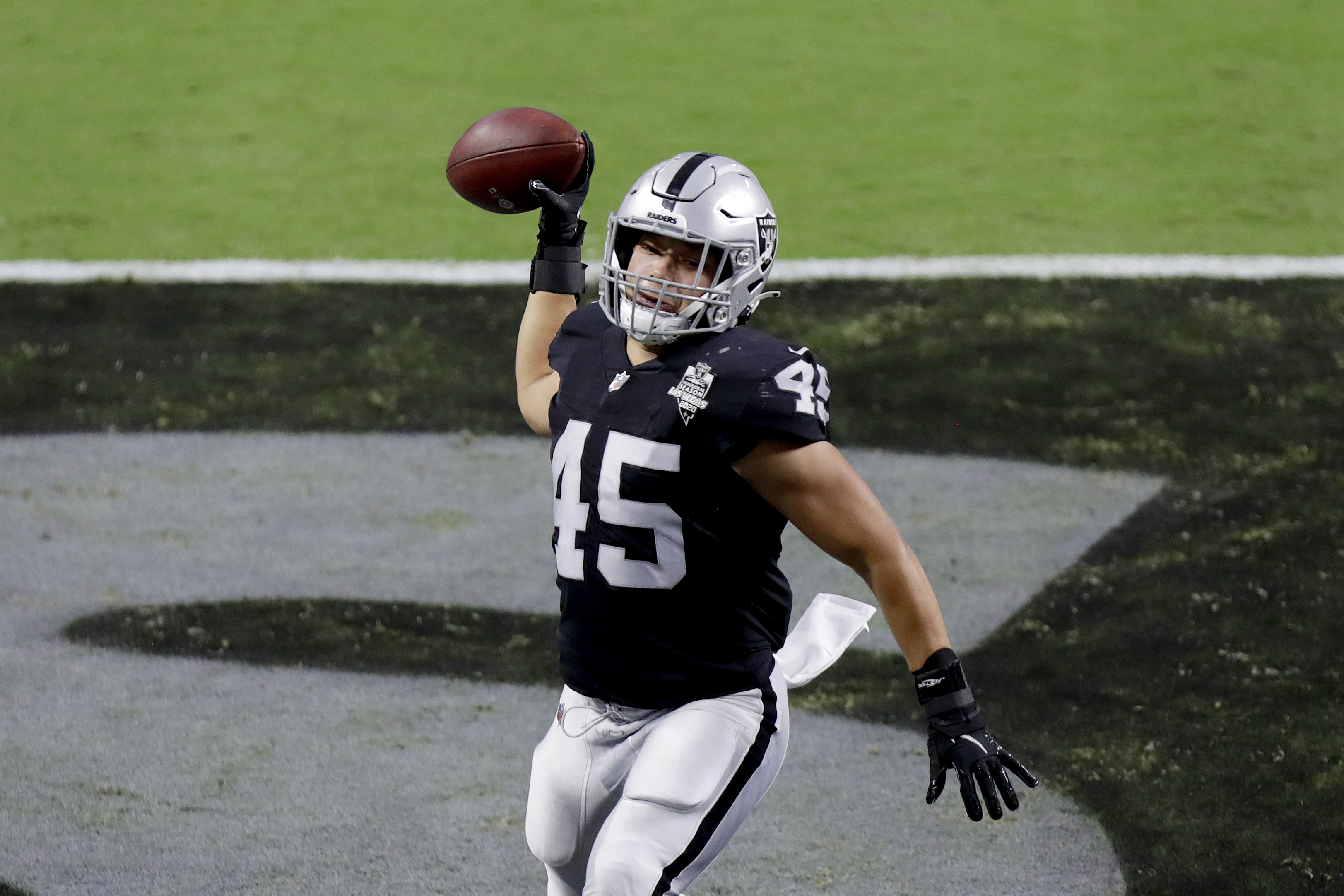 Las Vegas Raiders fullback Alec Ingold (45) jumps into the stands