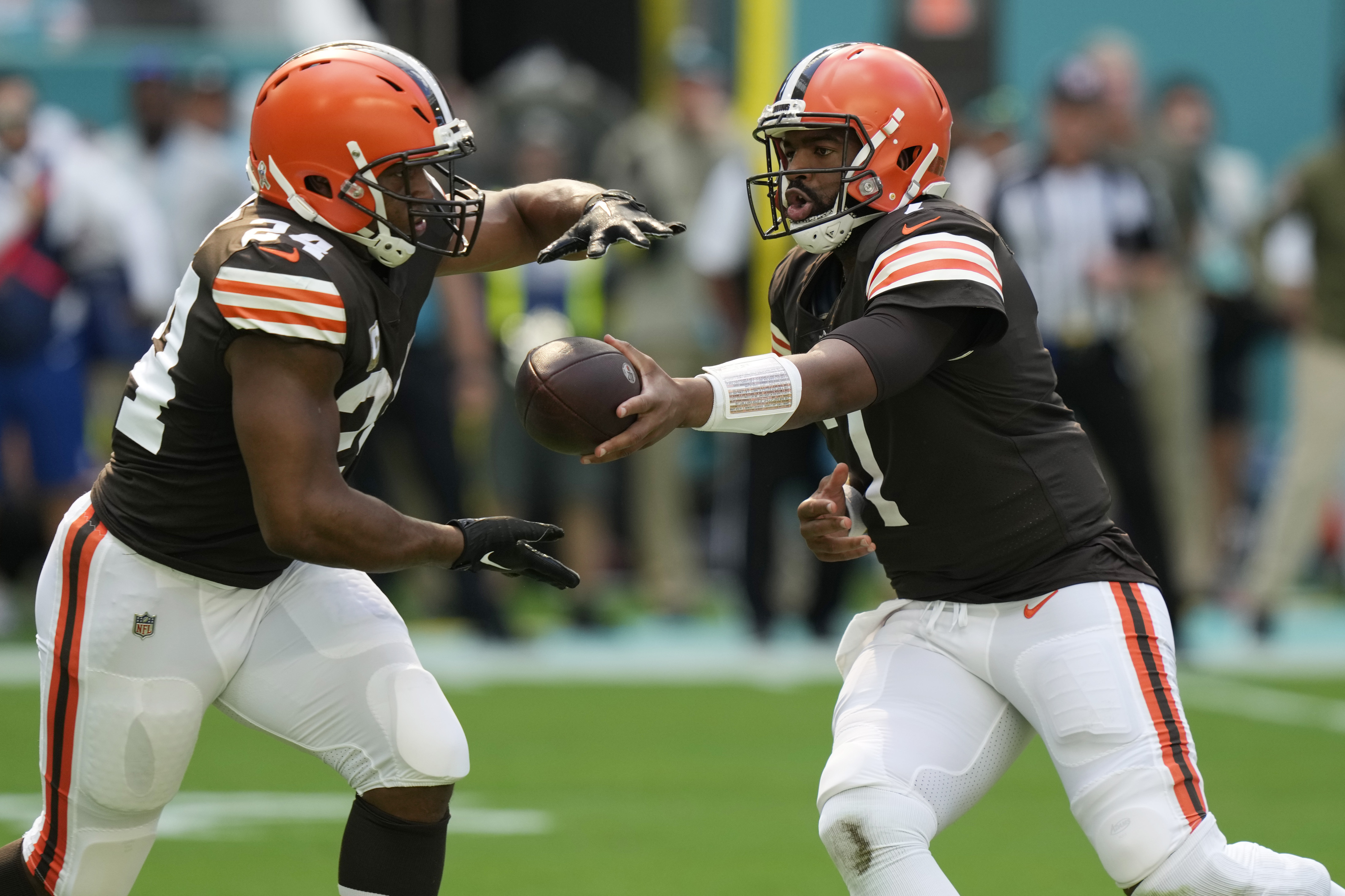 Cleveland Browns running back Nick Chubb (24) and Miami Dolphins wide  receiver Tyreek Hill (10) exchange jerseys at the end of an NFL football  game, Sunday, Nov. 13, 2022, in Miami Gardens