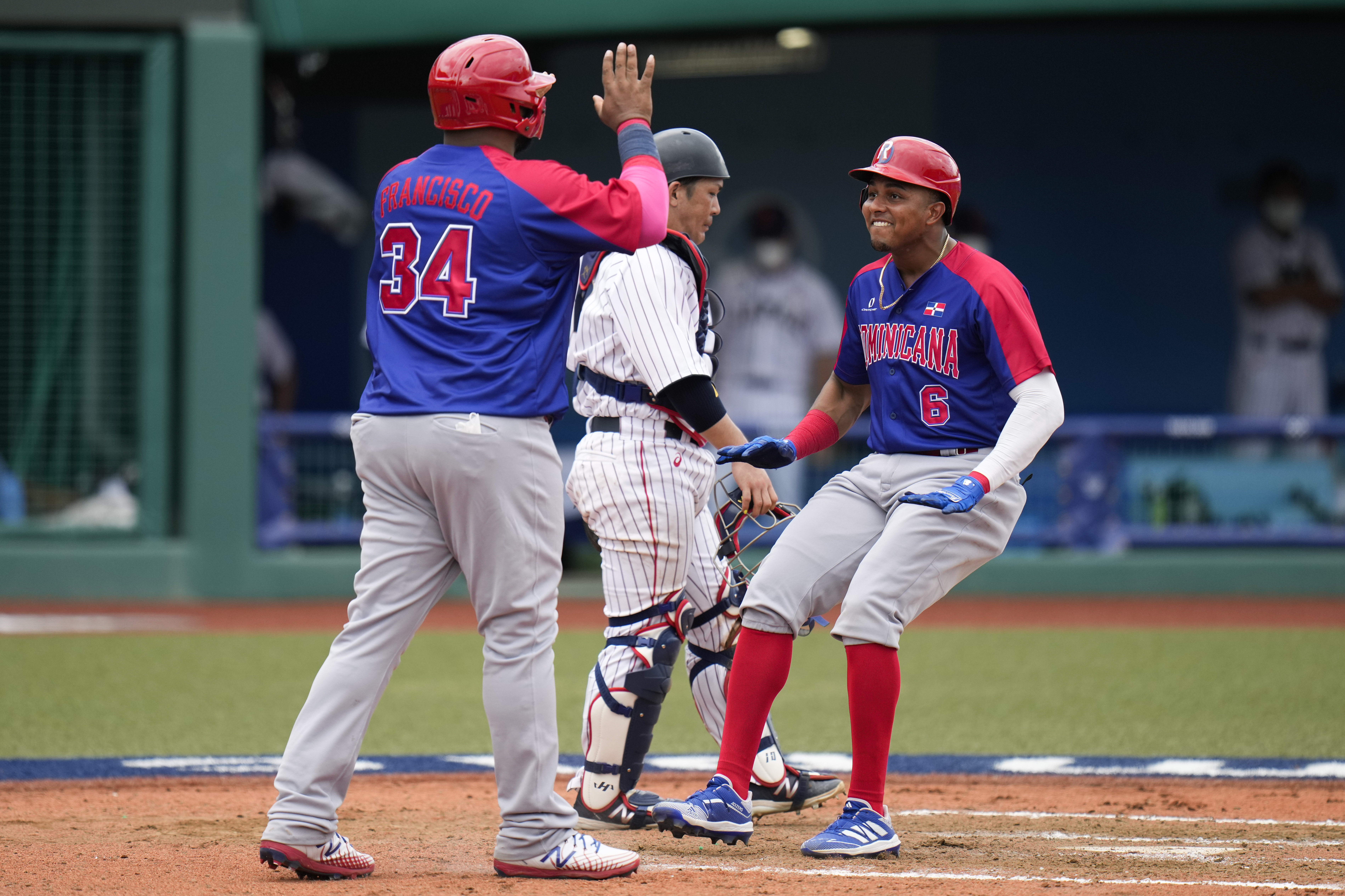 Timely bunt rallies Japan past DR in 9th in Olympic opener