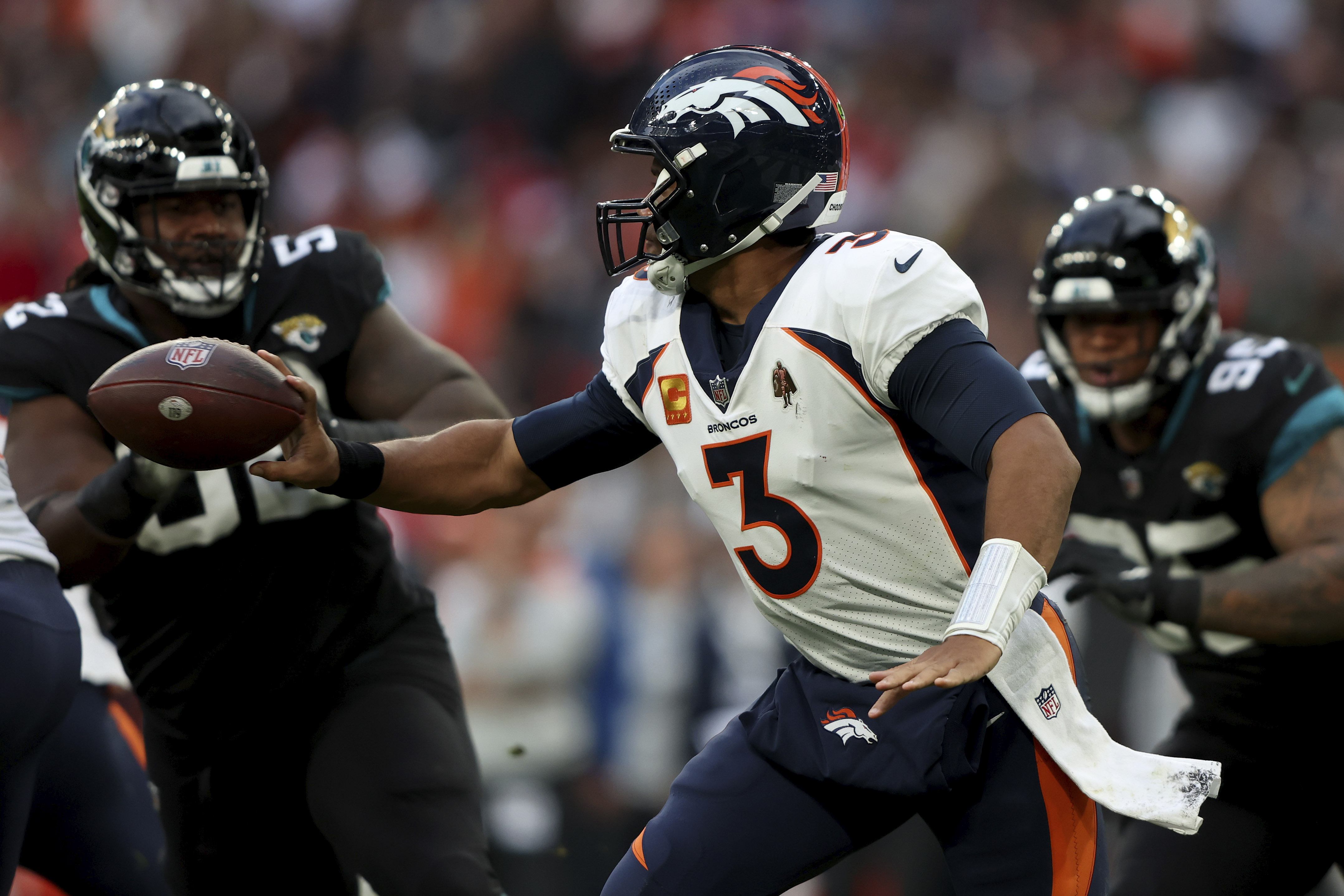 Denver Broncos quarterback Russell Wilson throws a pass during the first  half of an NFL preseason football game against the Arizona Cardinals in  Glendale, Ariz., Friday, Aug. 11, 2023. (AP Photo/Matt York