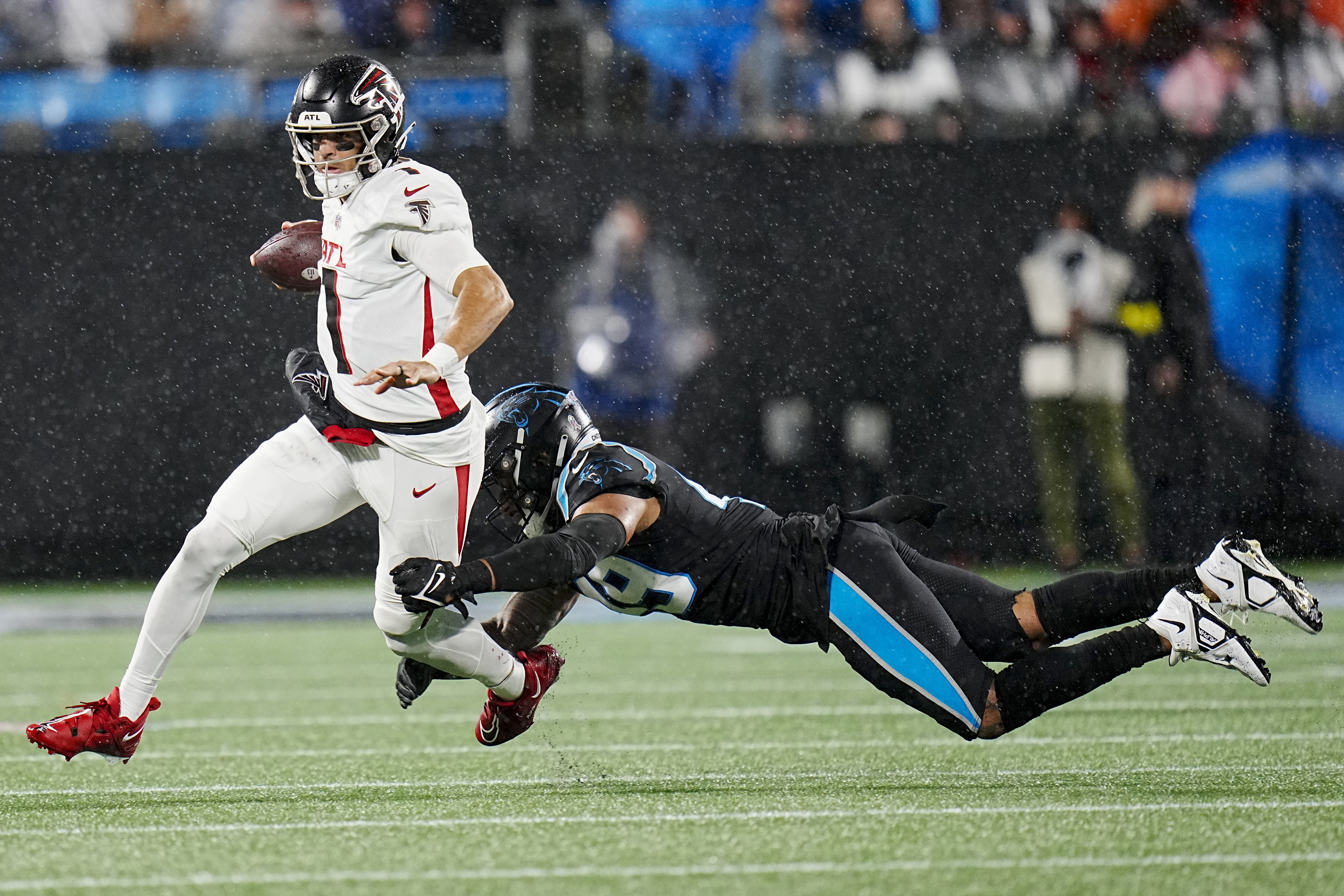 D'Onta Foreman leads Panthers past rival Falcons in rain