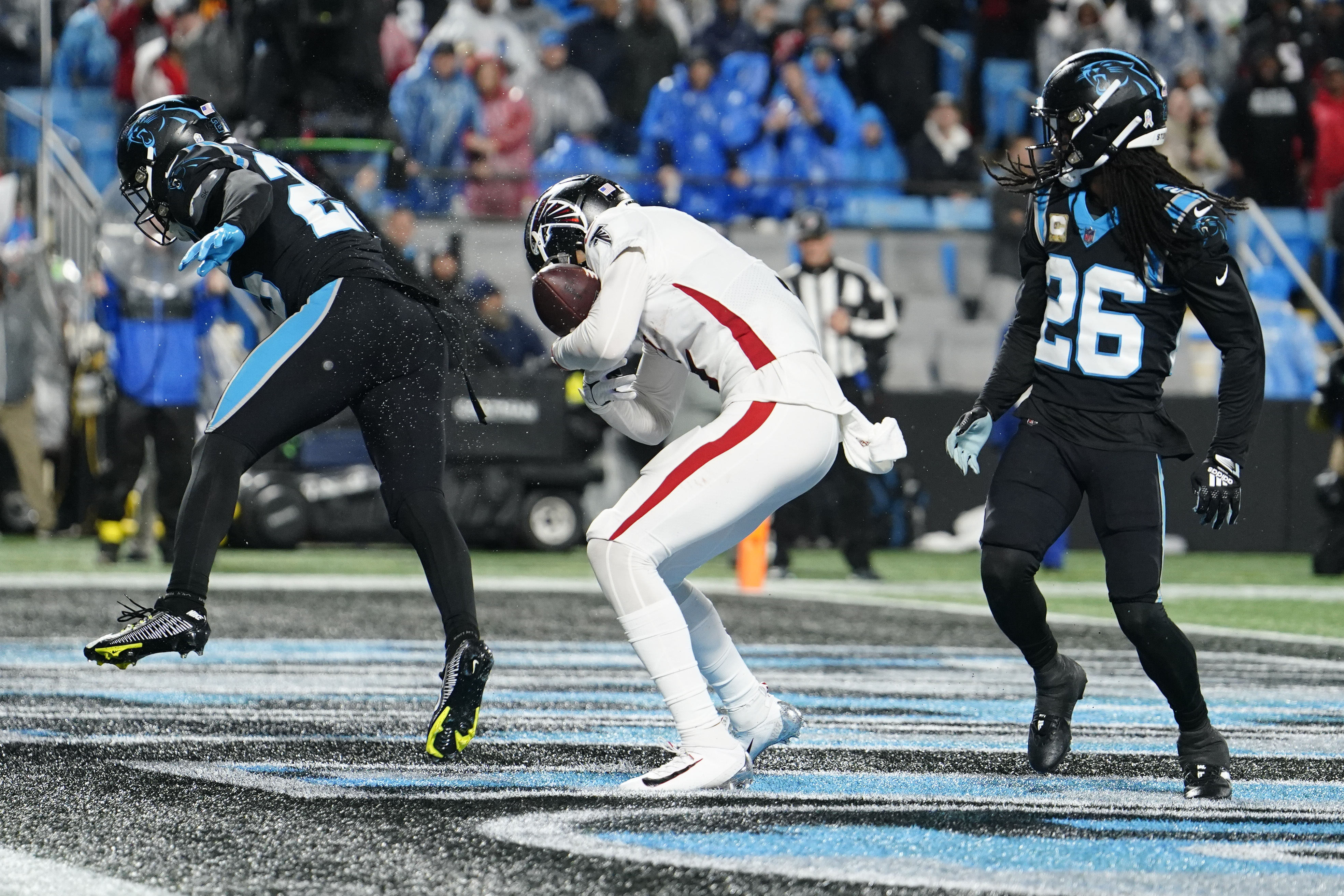 Foreman leads Panthers past rival Falcons in rain, 25-15