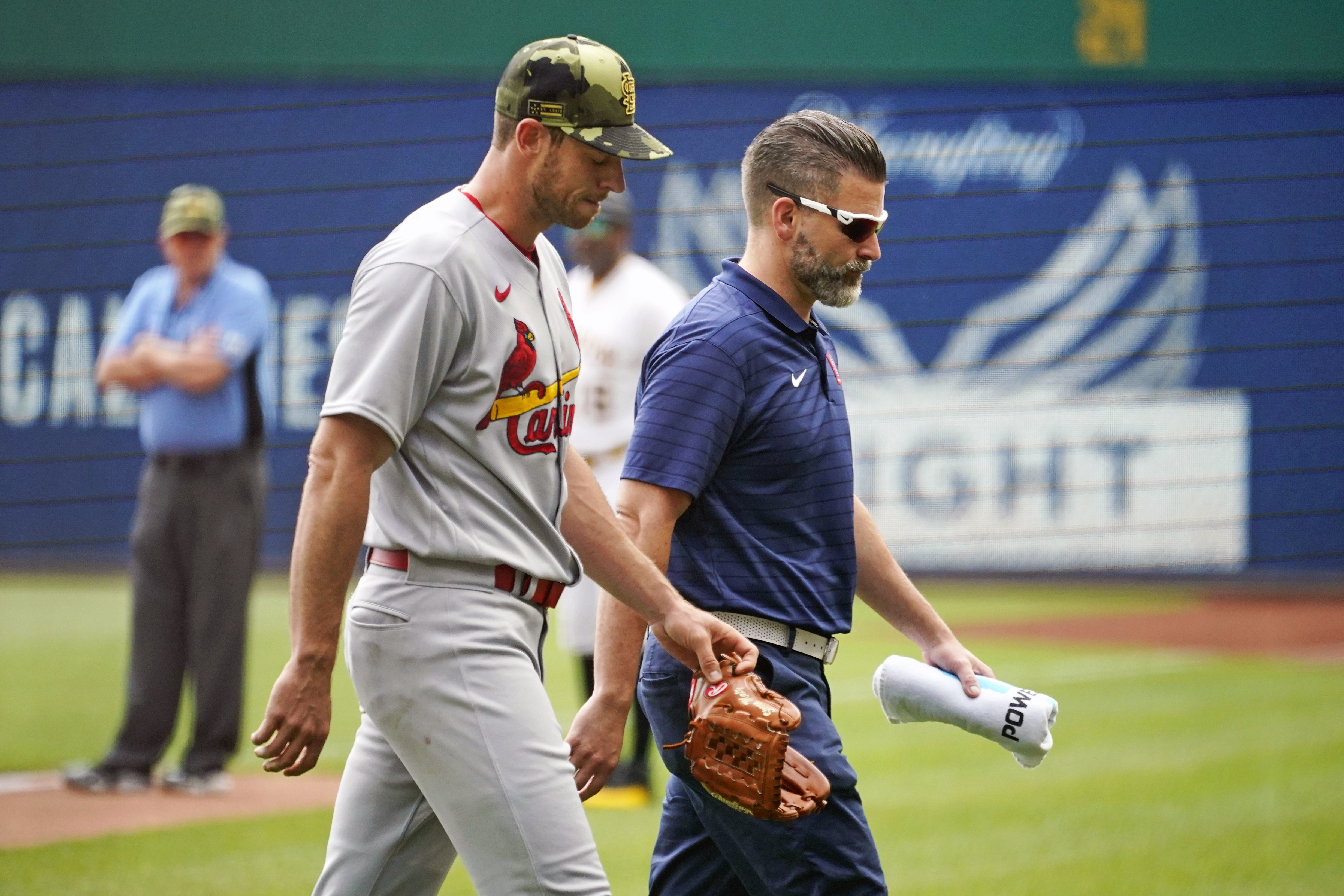 Pittsburgh Pirates' Yoshi Tsutsugo, left, tips his helmet as he