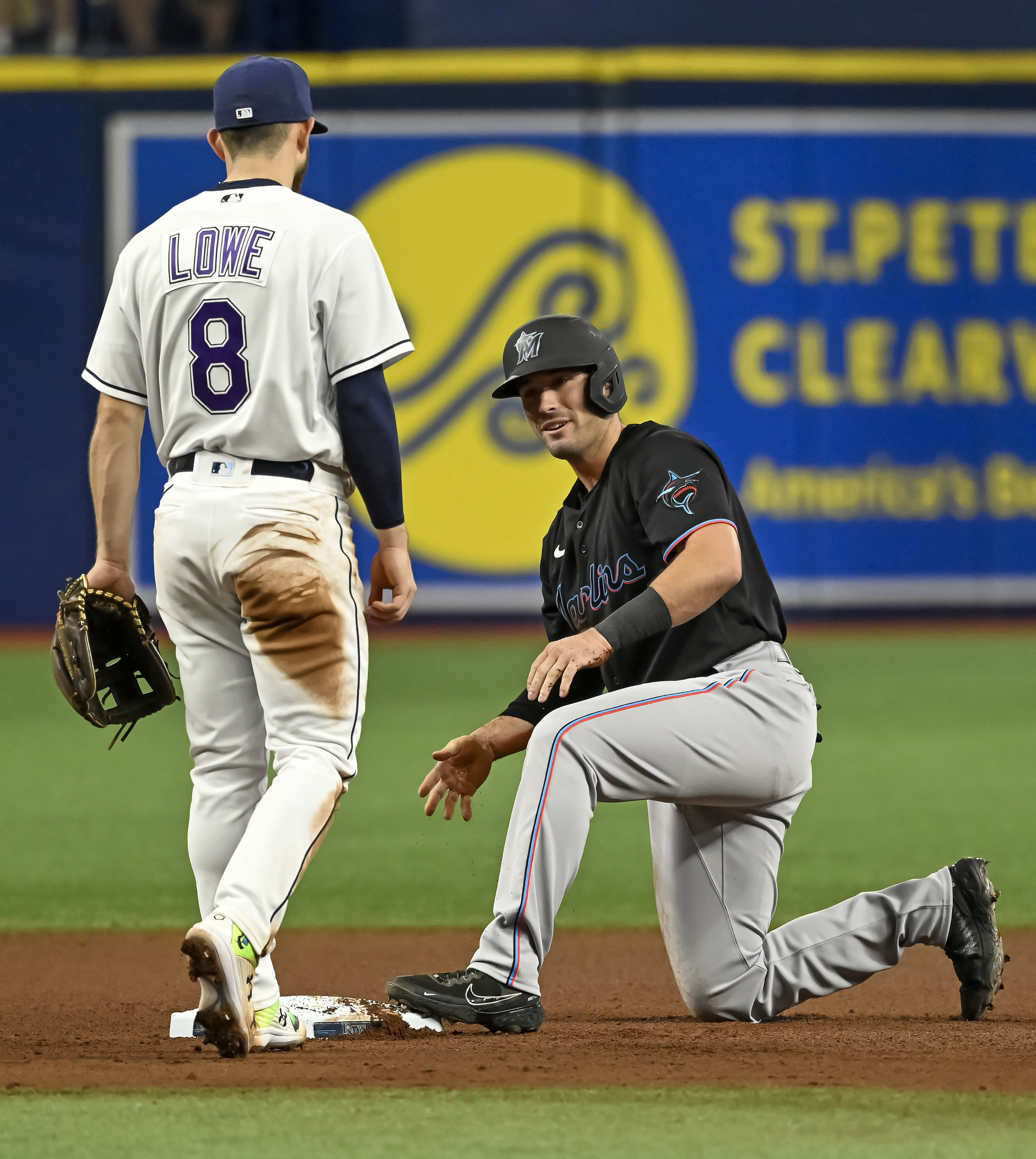 Miami Marlins' Jazz Chisholm loses his helmet as he runs to first base with  a single during the first inning of a baseball game against the New York  Yankees, Sunday, Aug. 1