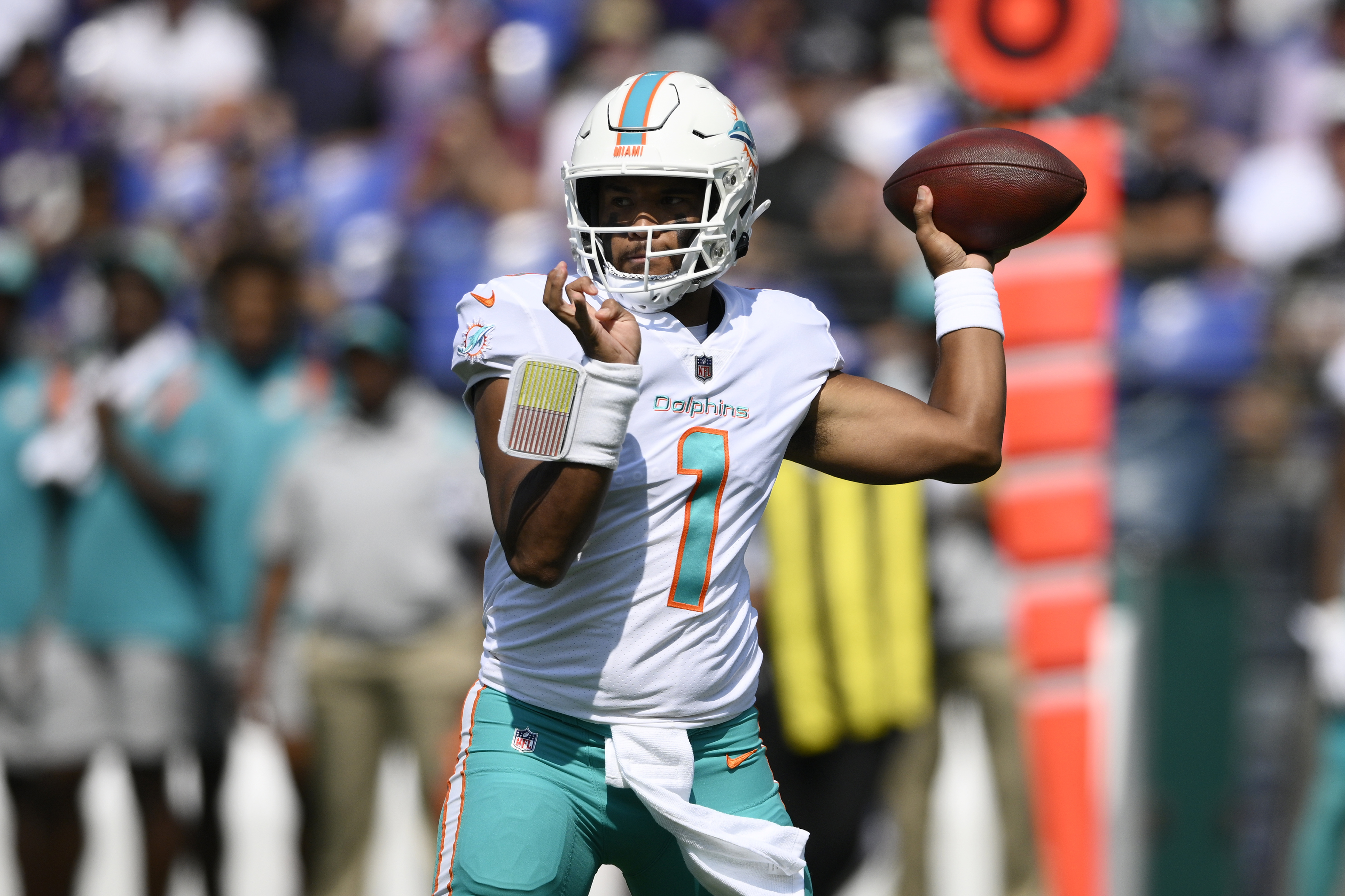 Miami Dolphins head coach Mike McDaniel greets quarterback Tua Tagovailoa  as players warm up before the start of an NFL football game against the Chicago  Bears, Sunday, Nov. 6, 2022 in Chicago. (