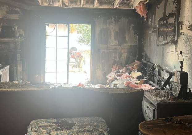 Family of 5 displaced after Christmas tree lights spark fire in