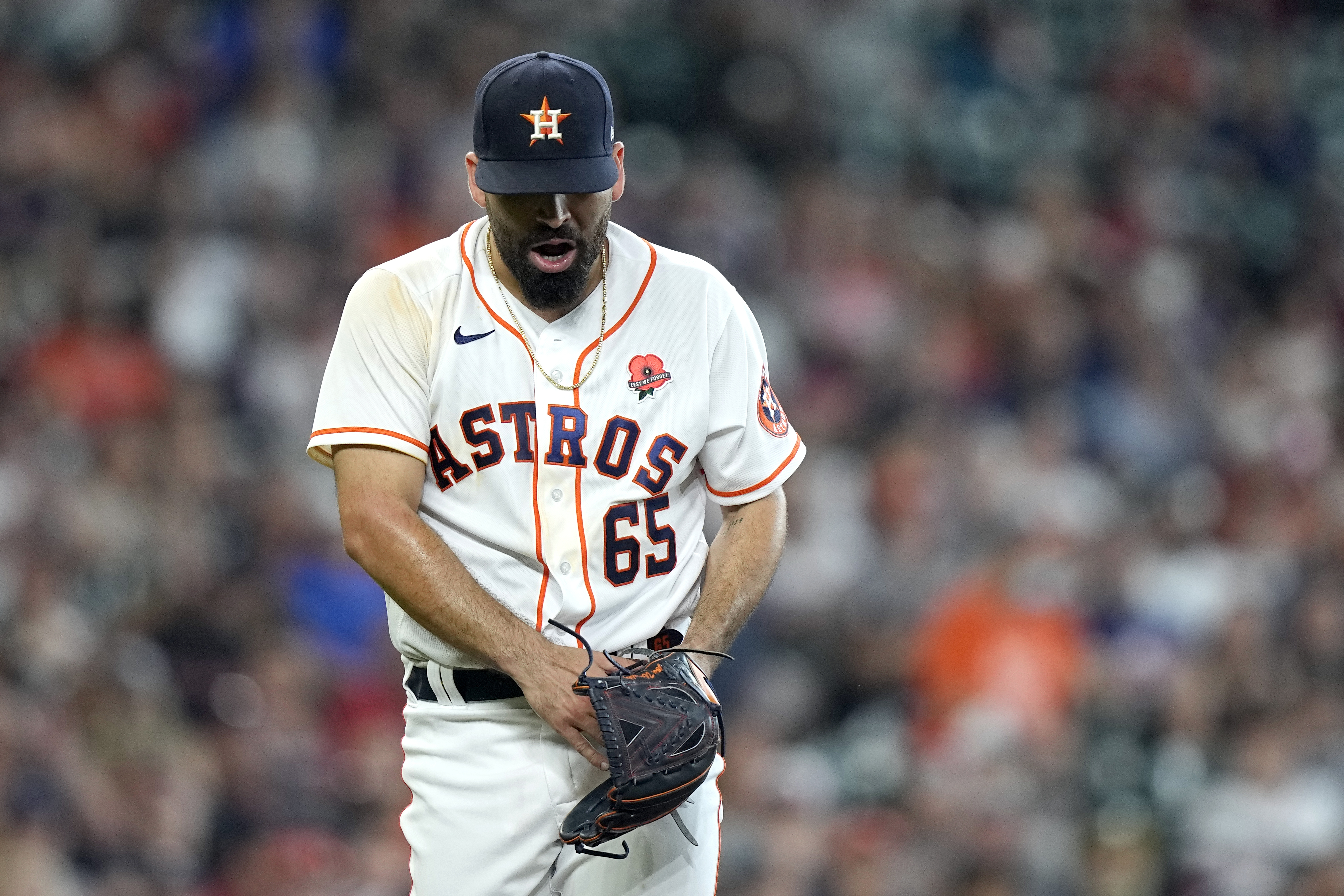 Houston Astros' Jose Urquidy (65) leaves the game during the