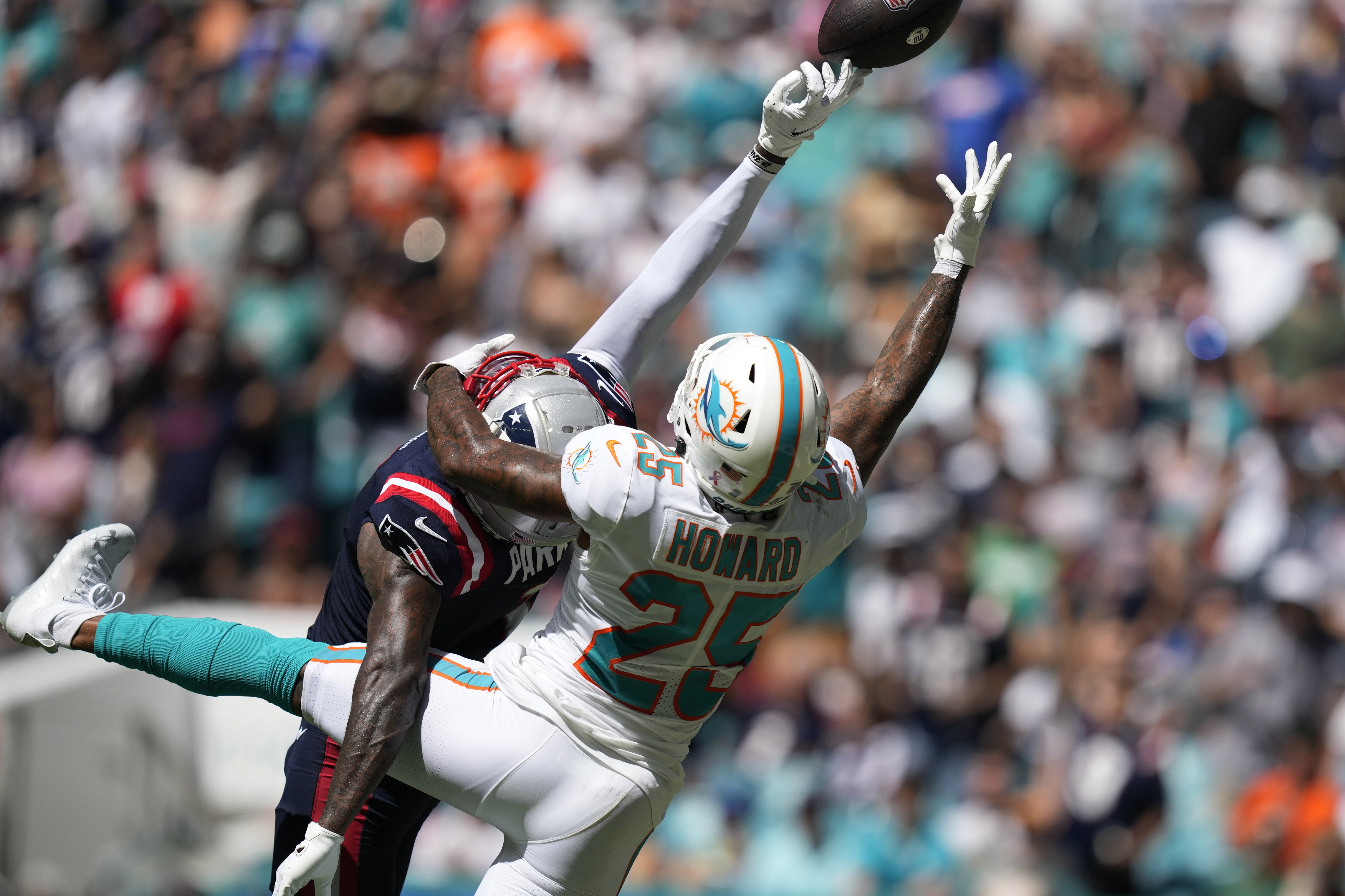 Miami Dolphins safety Jevon Holland (8) enters the field through the smoke  before an NFL football game against the Buffalo Bills, Sunday, Sept. 25,  2022 in Miami Gardens, Fla. The Dolphins defeat