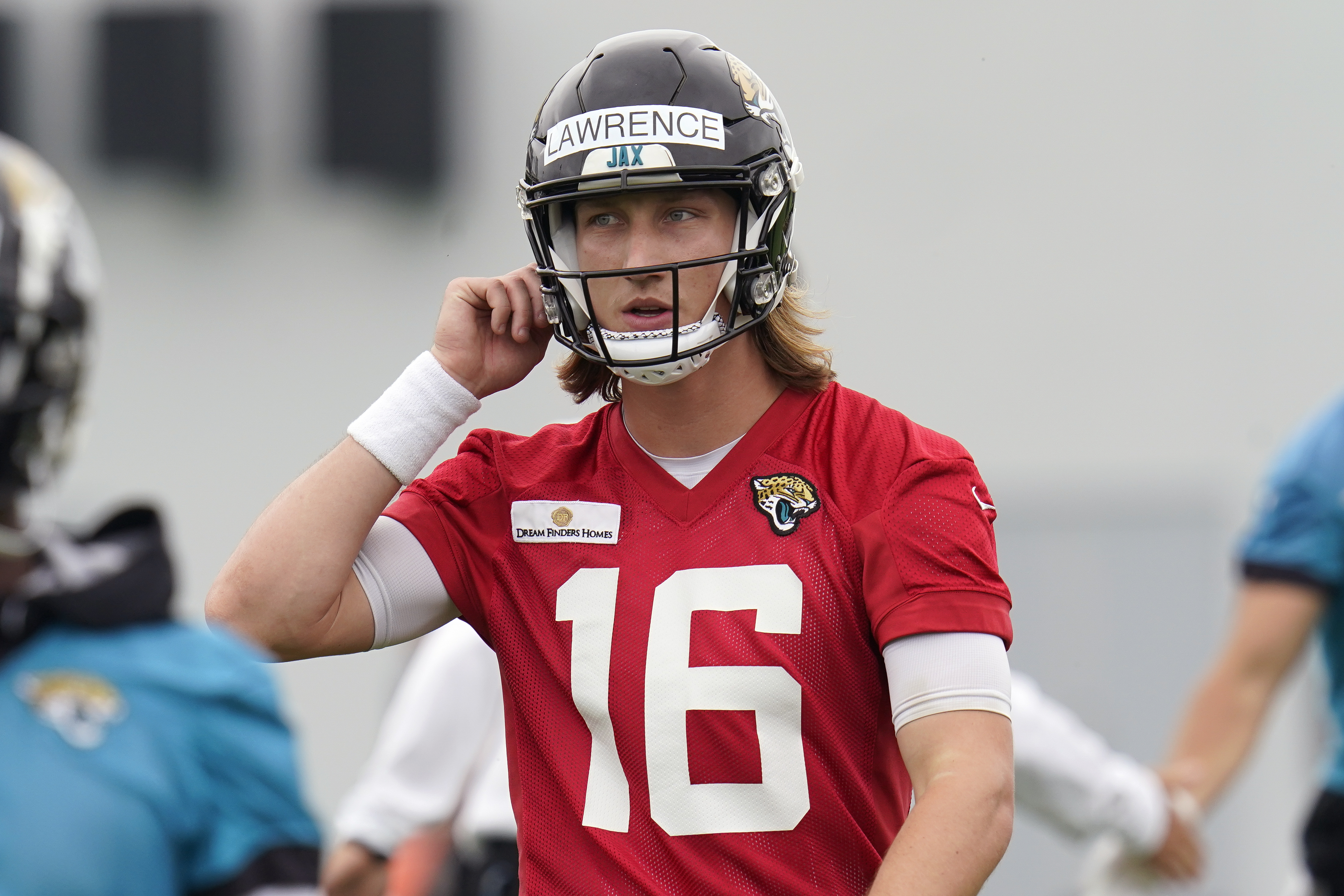 Trevor Lawrence Jacksonville Jaguars Autographed Practice-Used #16 Red  Jersey from Rookie Mini-Camp During the 2021 NFL Season