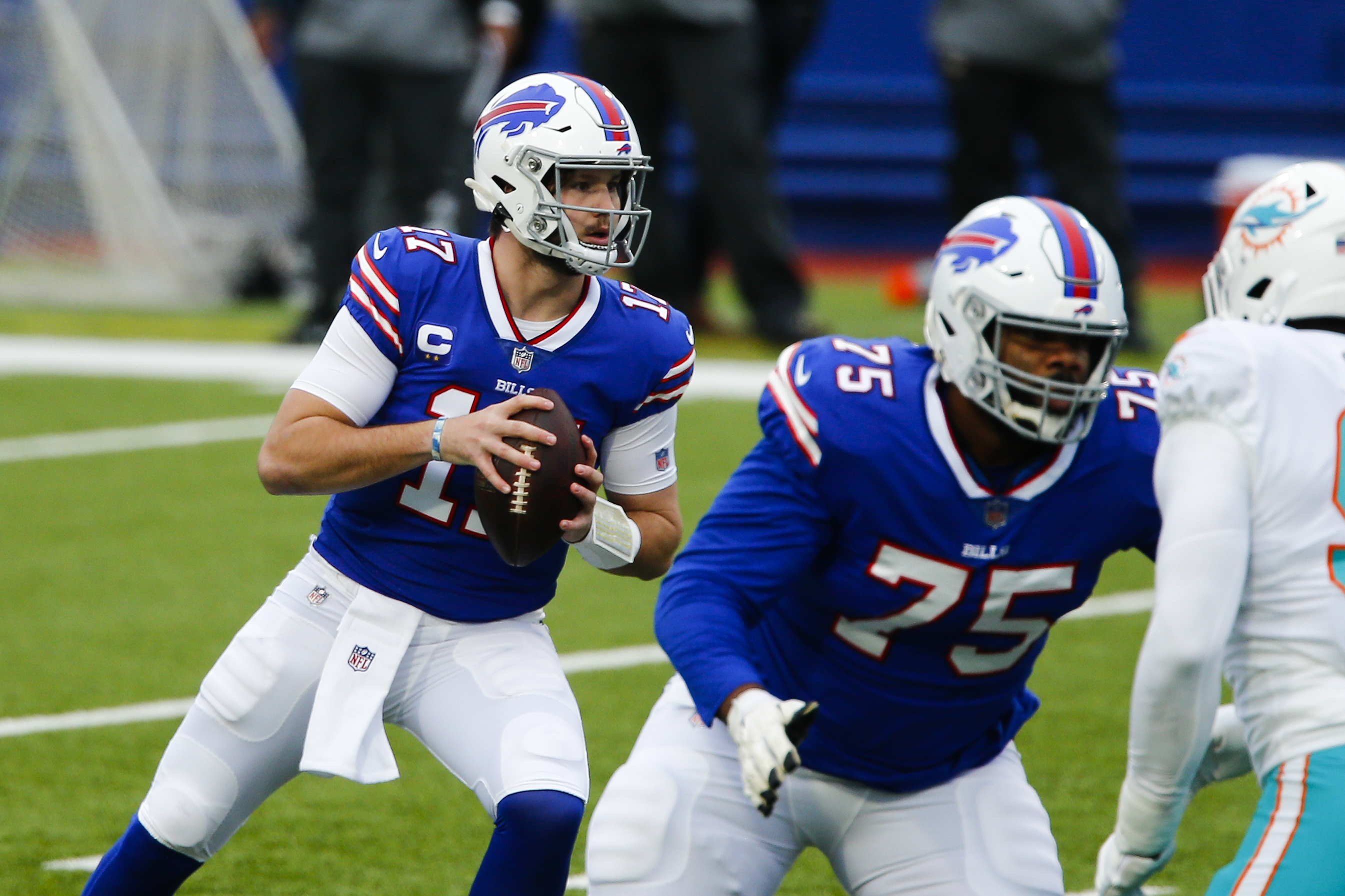 Josh Allen makes huge 4th quarter plays and Bills clinch playoff spot with  win over Dolphins
