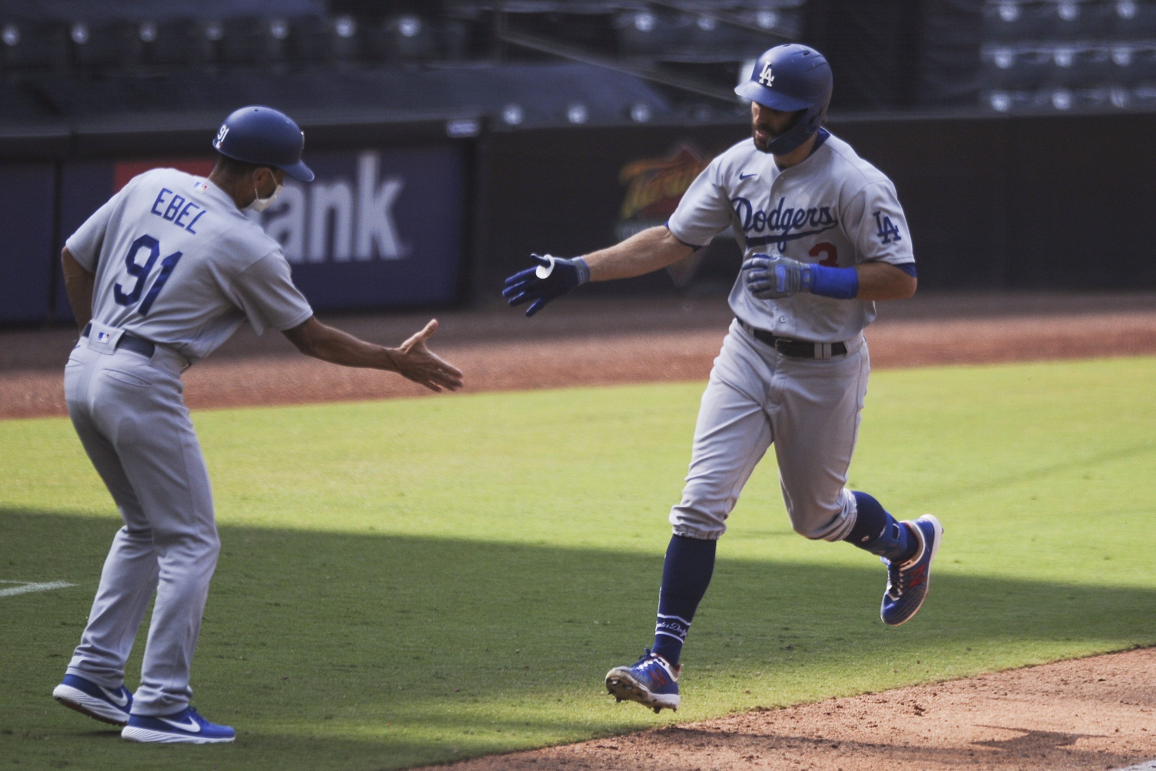Dodgers 1st team to clinch playoff spot, beat Padres 7-5