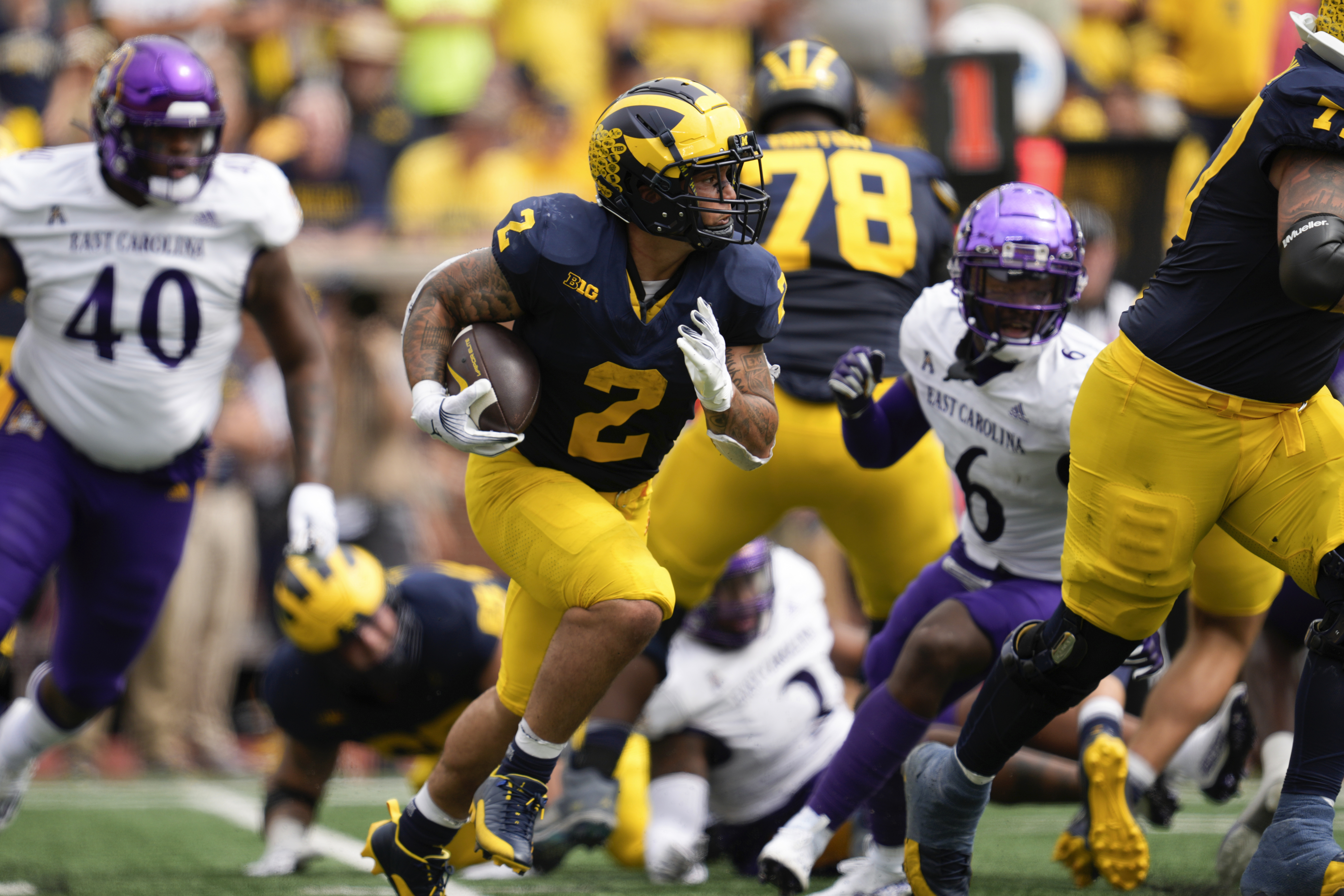 Michigan quarterback J.J. McCarthy warms up in 'Free Harbaugh' shirt after  suspension