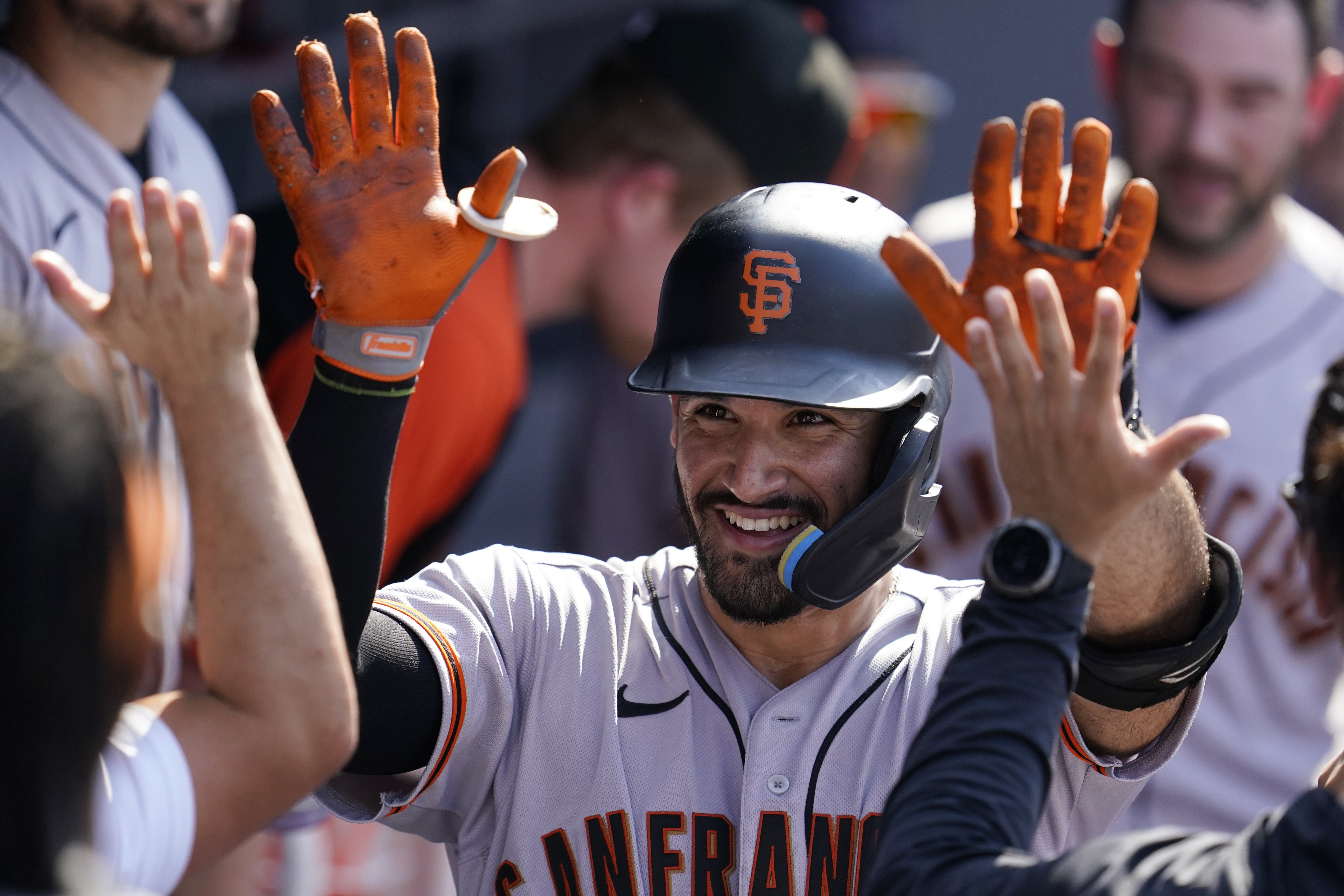 San Francisco Giants' Lewis Brinson, from left, celebrates with