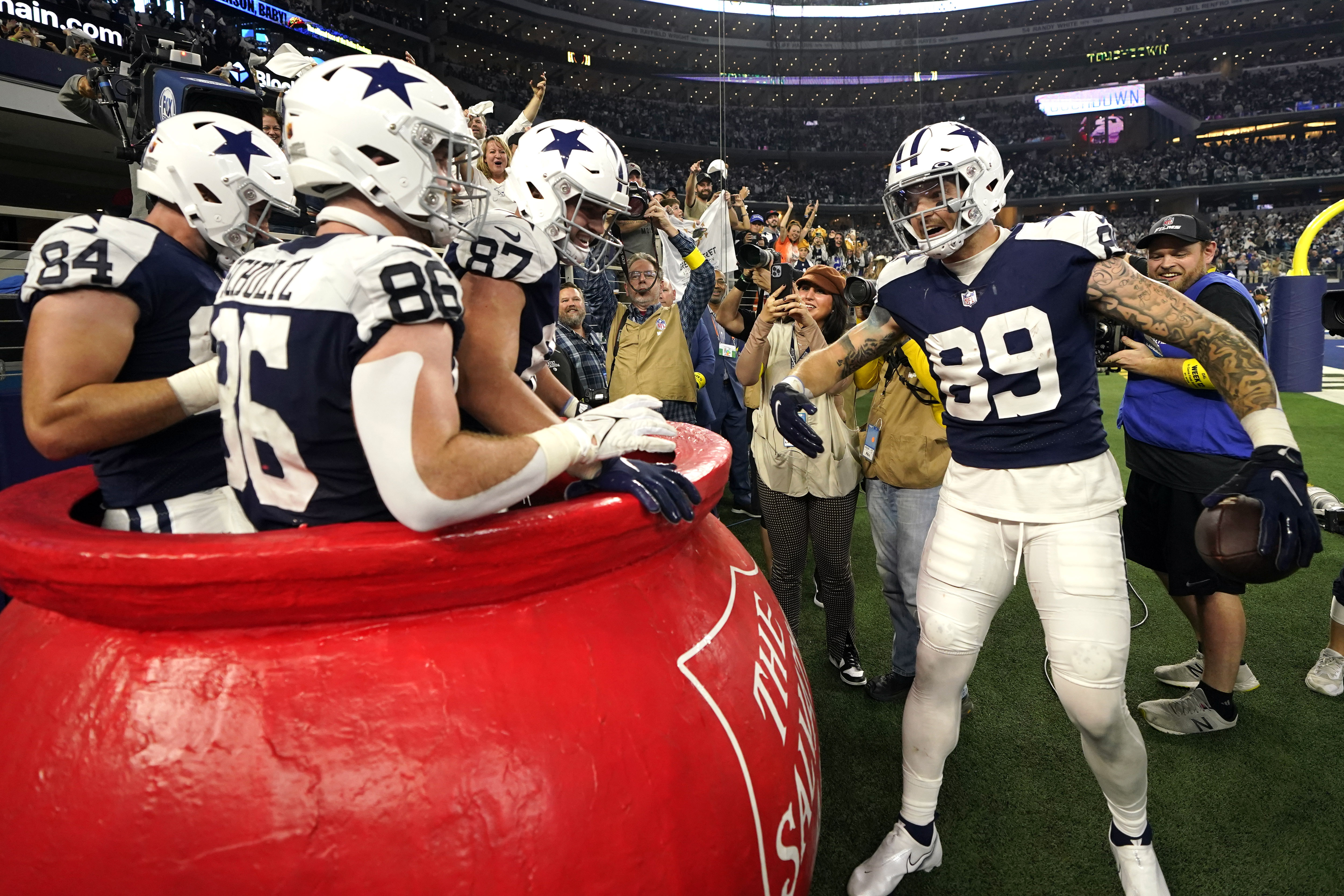 Dallas Cowboys' Dak Prescott (4) and CeeDee Lamb (88) celebrate after Lamb  caught a touchdown pass during the second half of an NFL football game  against the Green Bay Packers Sunday, Nov.