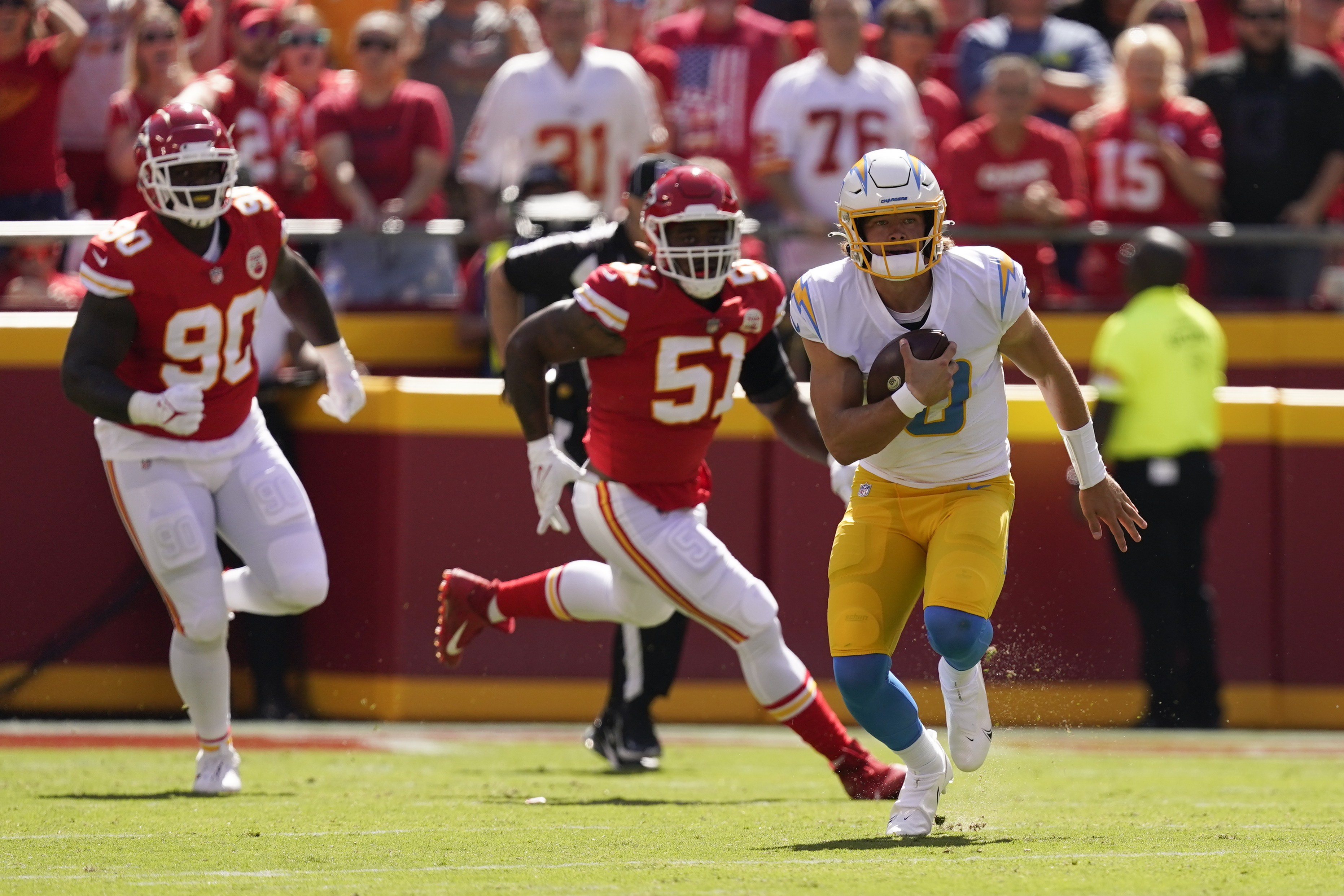 Kansas City Chiefs quarterback Patrick Mahomes runs the ball during the  second half of an NFL football game against the Los Angeles Chargers  Sunday, Sept. 26, 2021, in Kansas City, Mo. (AP