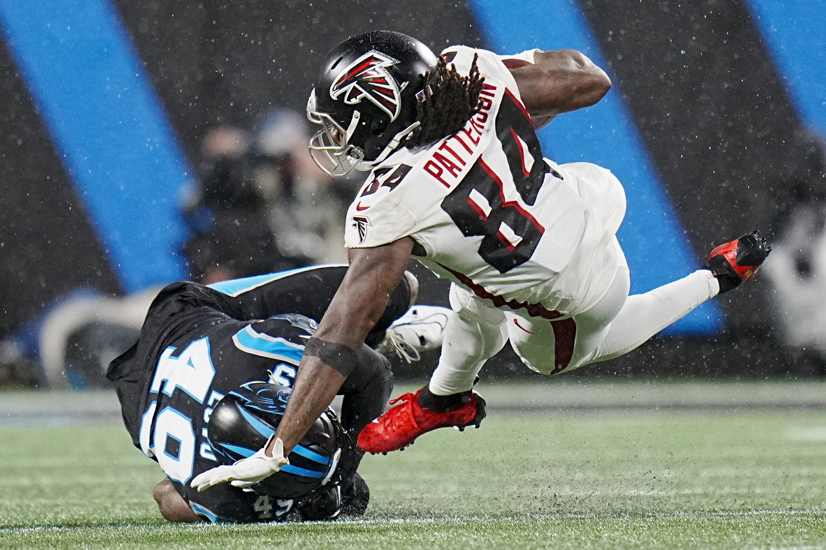 D'Onta Foreman leads Panthers past rival Falcons in rain