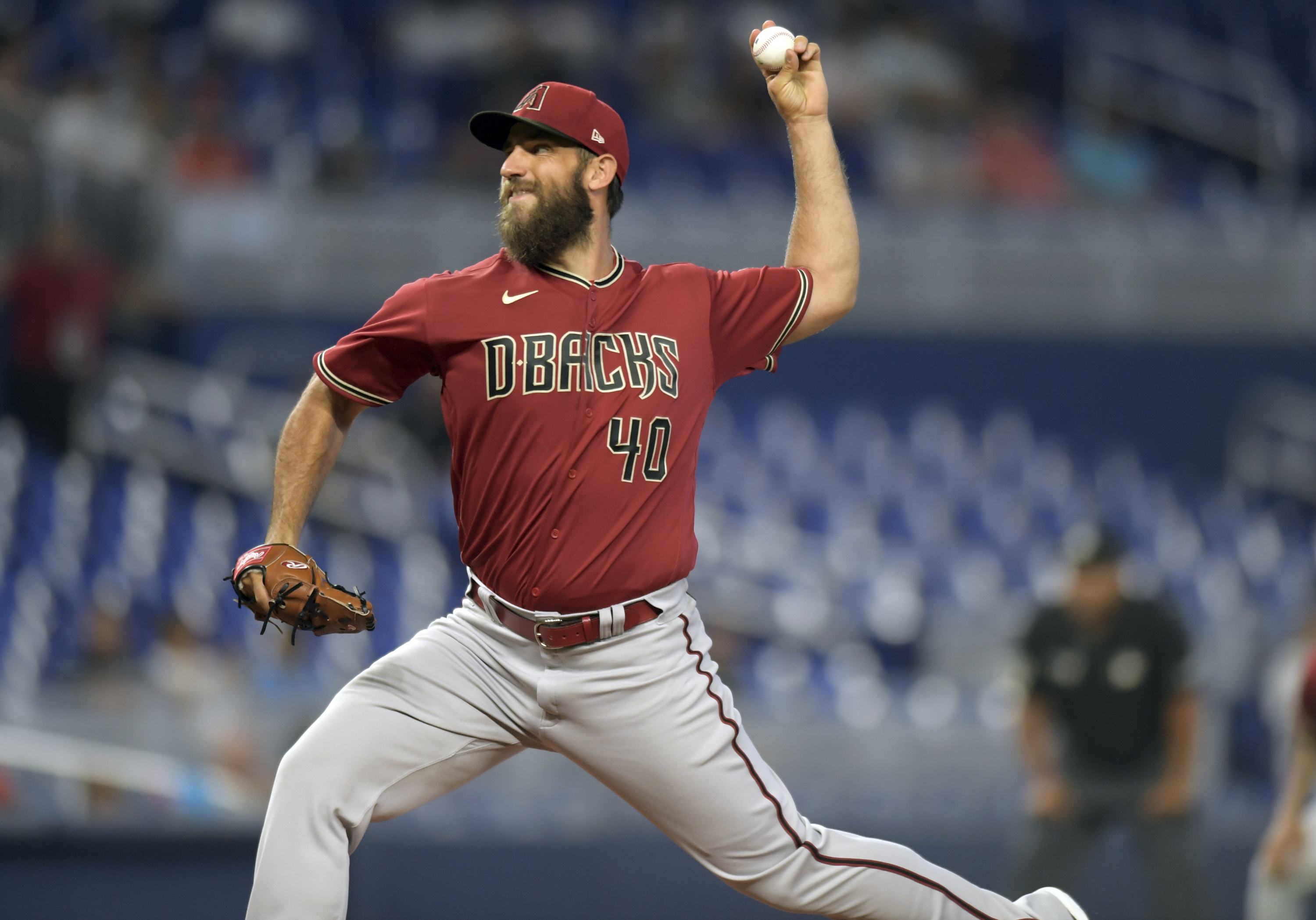 Arizona's Madison Bumgarner held back by teammates after first-inning  ejection, Arizona Diamondbacks