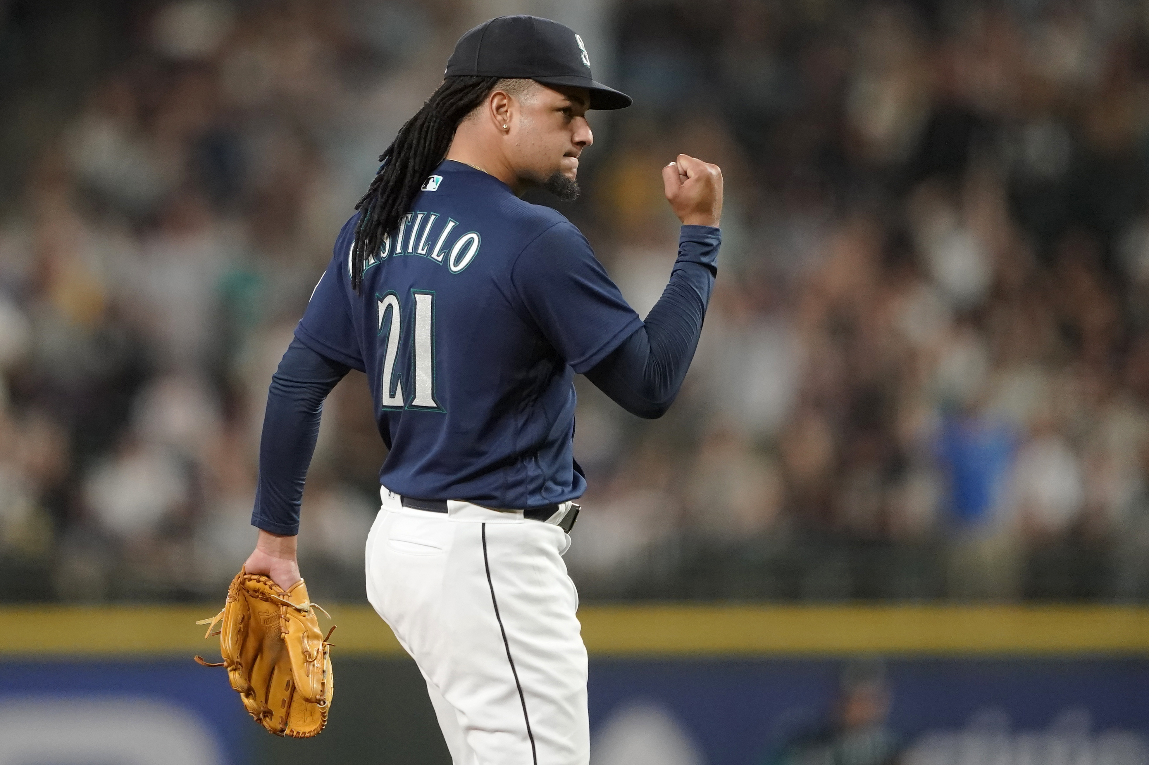 Seattle Mariners' Cal Raleigh, left, celebrates with Julio Rodriguez,  right, after hitting a walk-off single during the 10th inning to win a  baseball game 1-0 against the New York Yankees, Wednesday, May