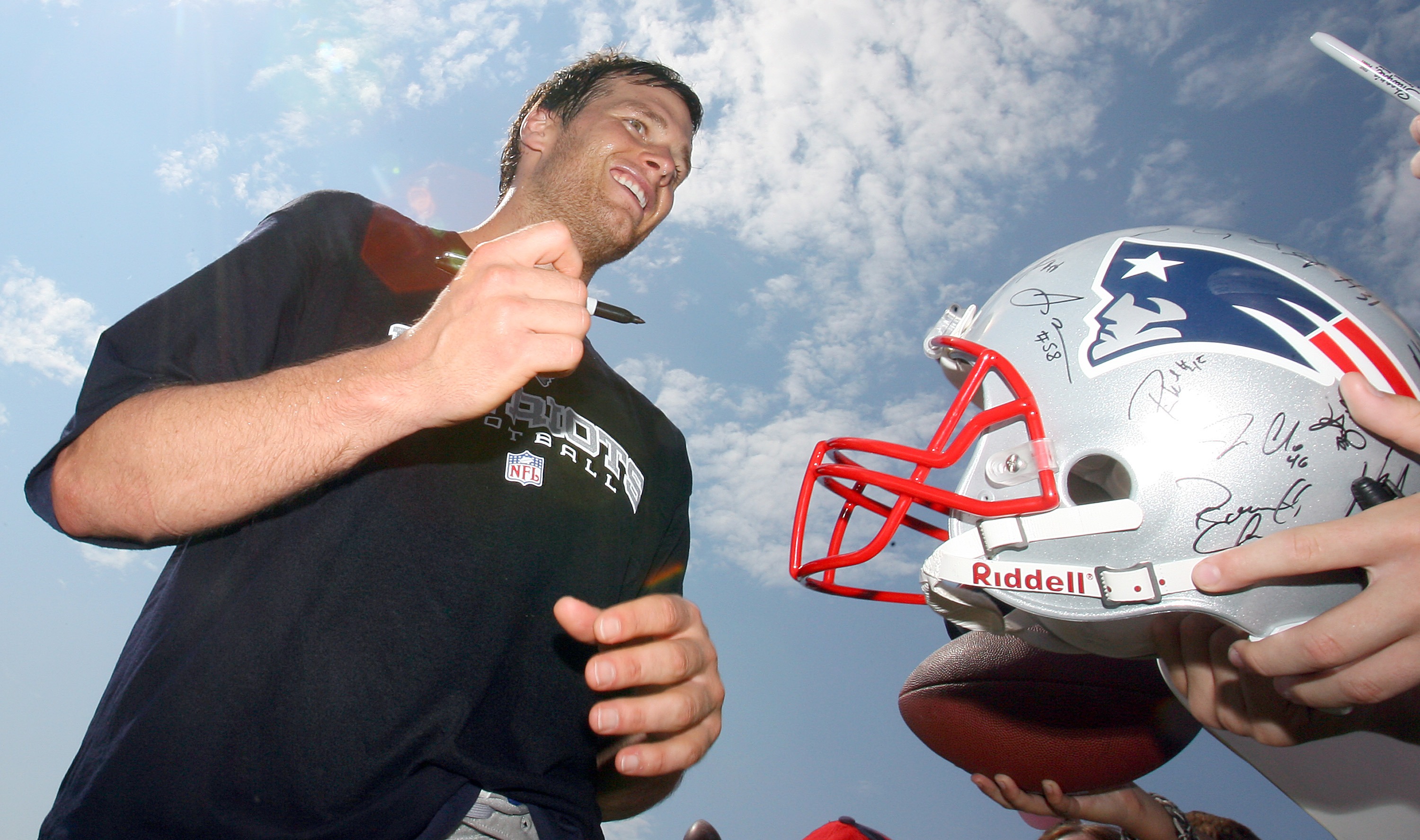 New England Patriots Tom Brady and head coach Bill Belichick smile on the  field during practice before the game against the New York Giants at Giants  Stadium in East Rutherford, New Jersey