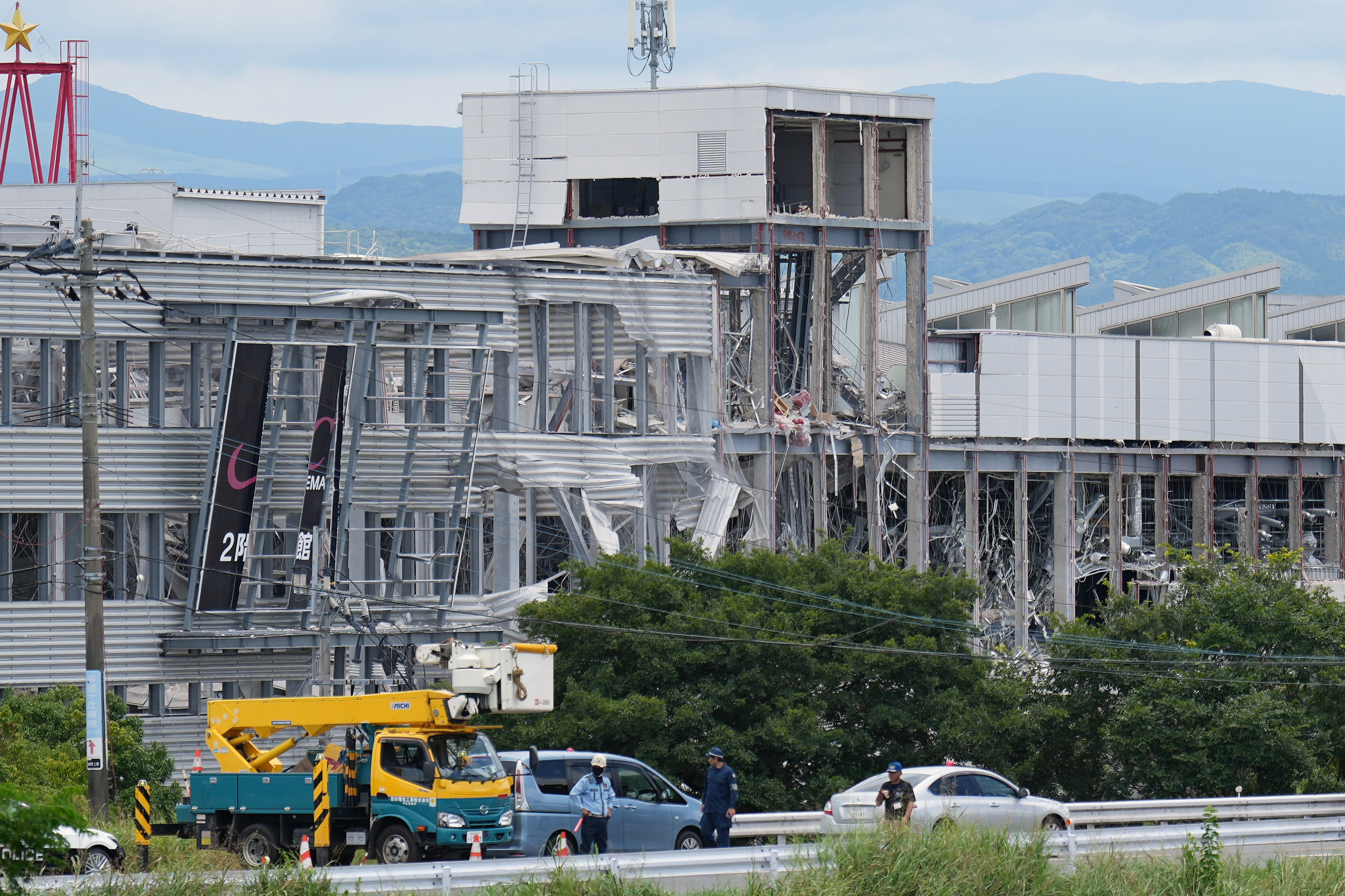 Rescuers search for survivors after a quake kills 18 in