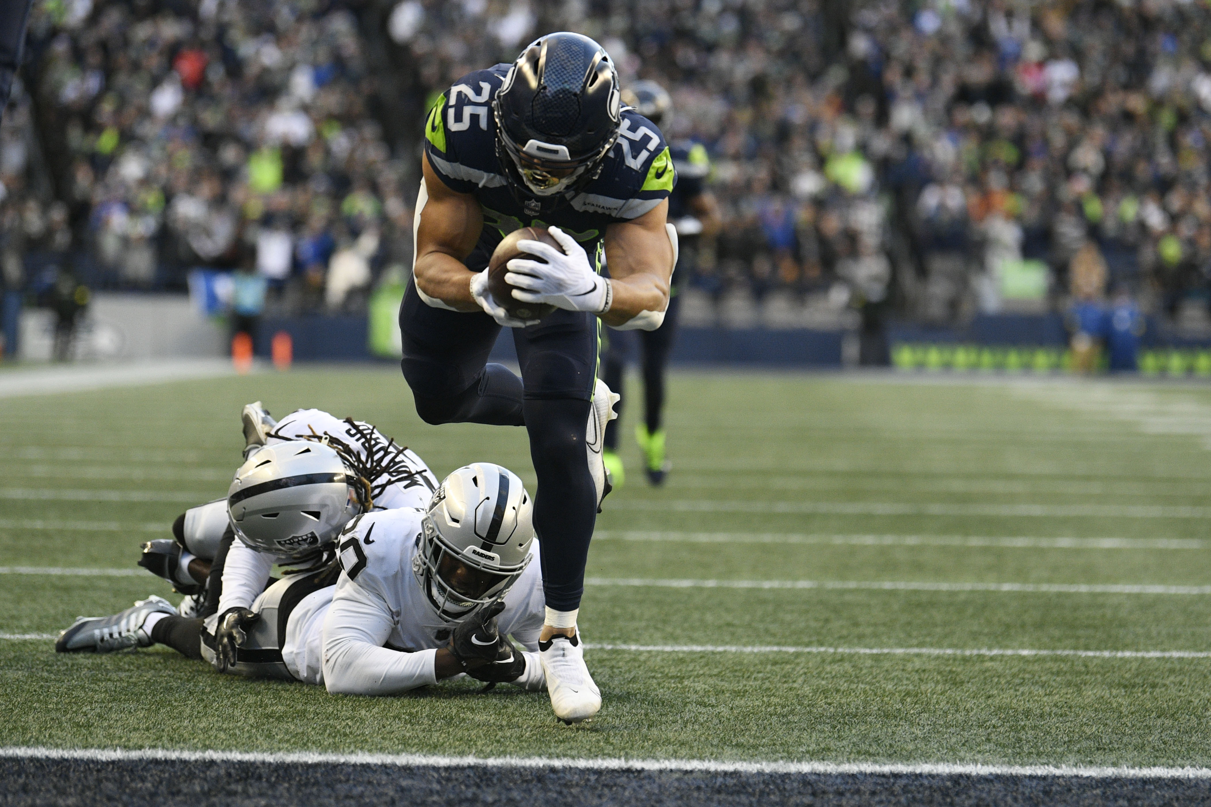 Las Vegas Raiders running back Josh Jacobs (28) makes an athletic catch  during an NFL football game against the Seattle Seahawks, Sunday, Nov. 27,  2022, in Seattle, WA. The Raiders defeated the