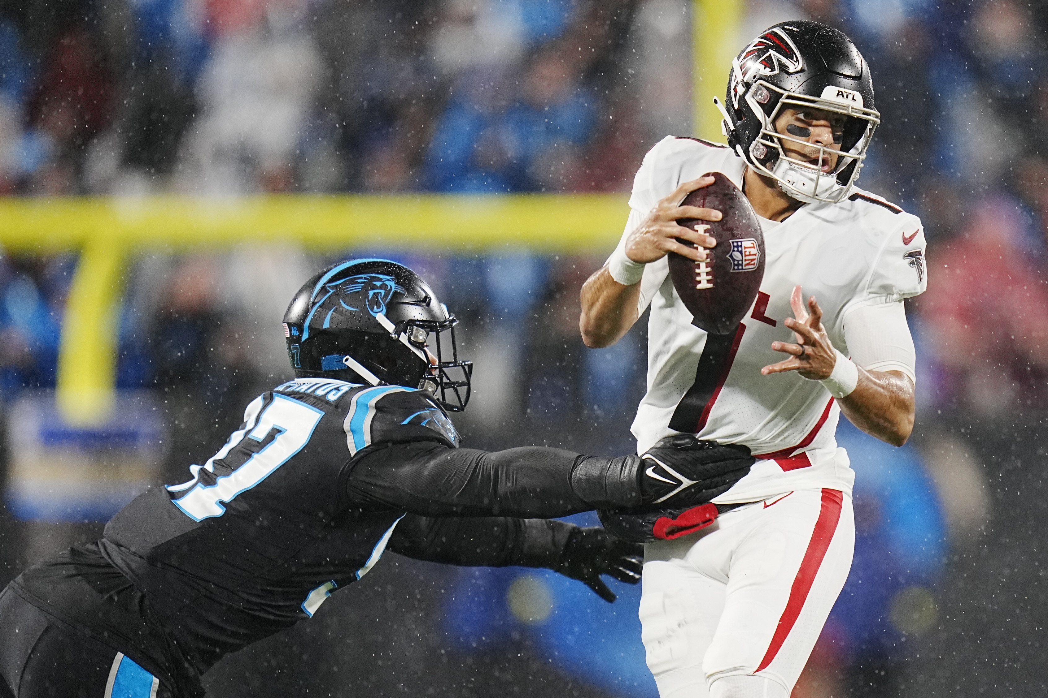 D'Onta Foreman leads Panthers past rival Falcons in rain