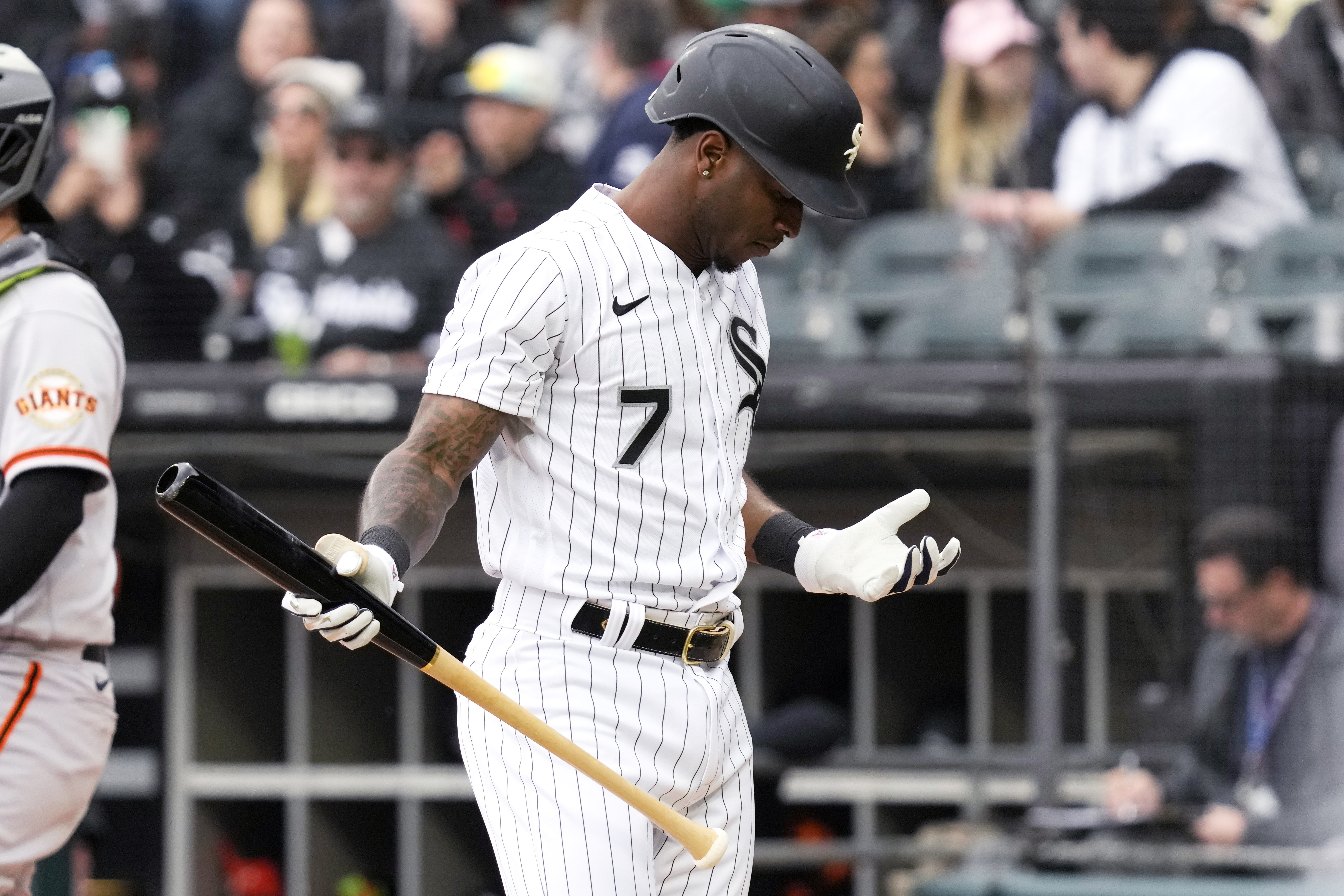 Luis Robert of the Chicago White Sox looks on from the dugout