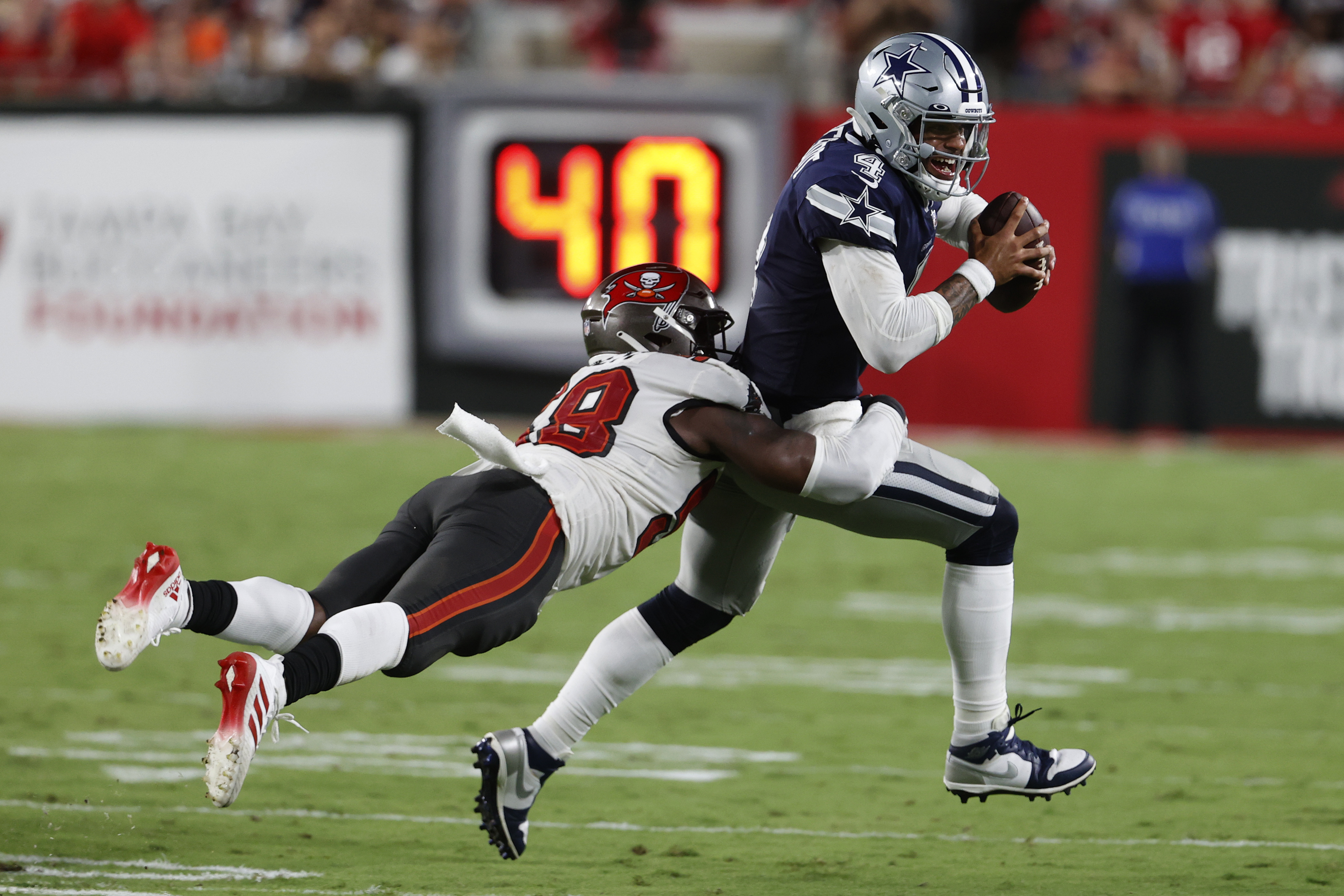 USA. 09th Sep, 2021. Dallas Cowboys quarterback Dak Prescott (4) runs out  of bounds during the first half against the Tampa Bay Buccaneers at Raymond  James Stadium, Thursday, Sept. 9, 2021, in