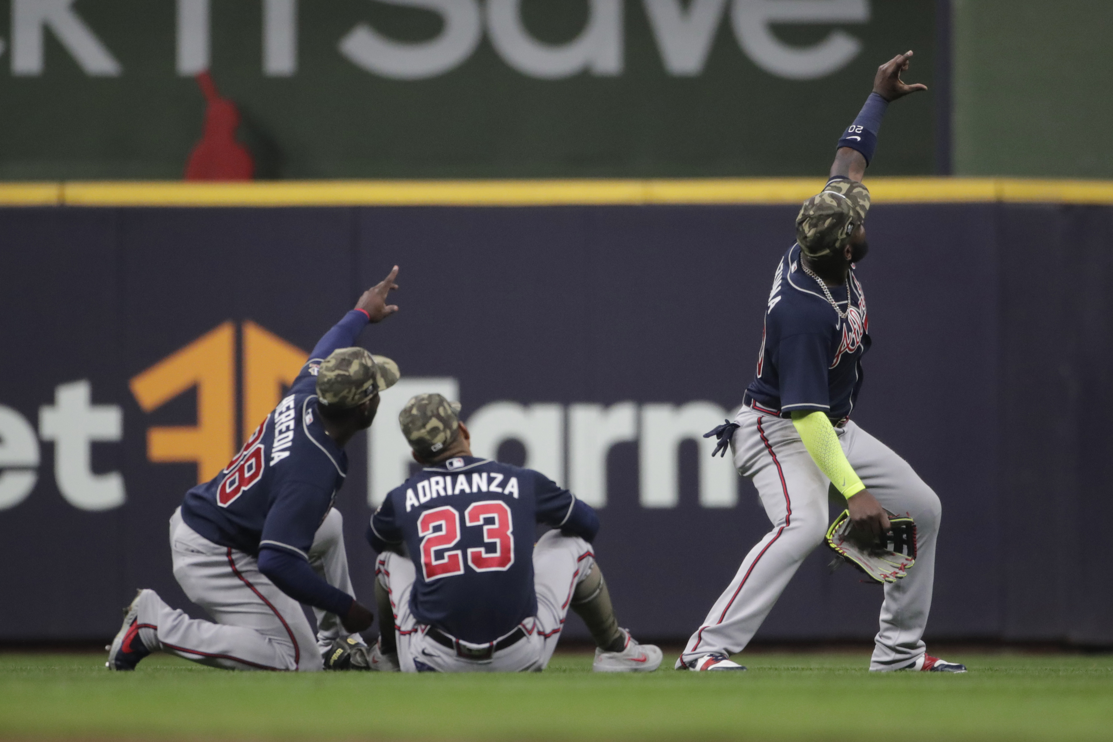 Huascar Ynoa and Tyler Flowers of the Atlanta Braves walk toward