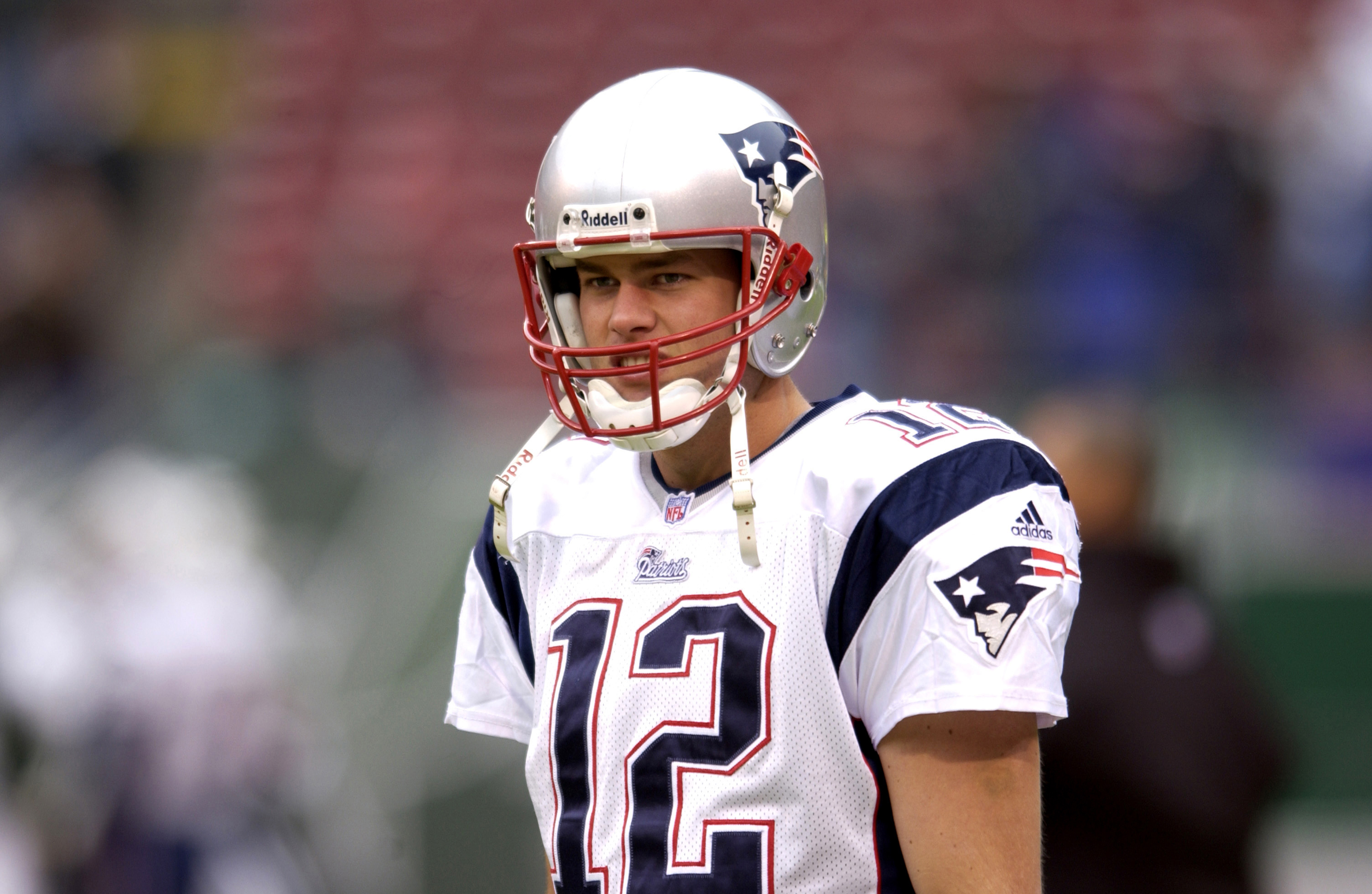 Patriot's quarterback Tom Brady (12) passes the time during pregame at  Super Bowl XXXVIII on February 1, 2004. The New England Patriots face the  Carolina Panthers at Reliant Stadium in Houston, Texas. (