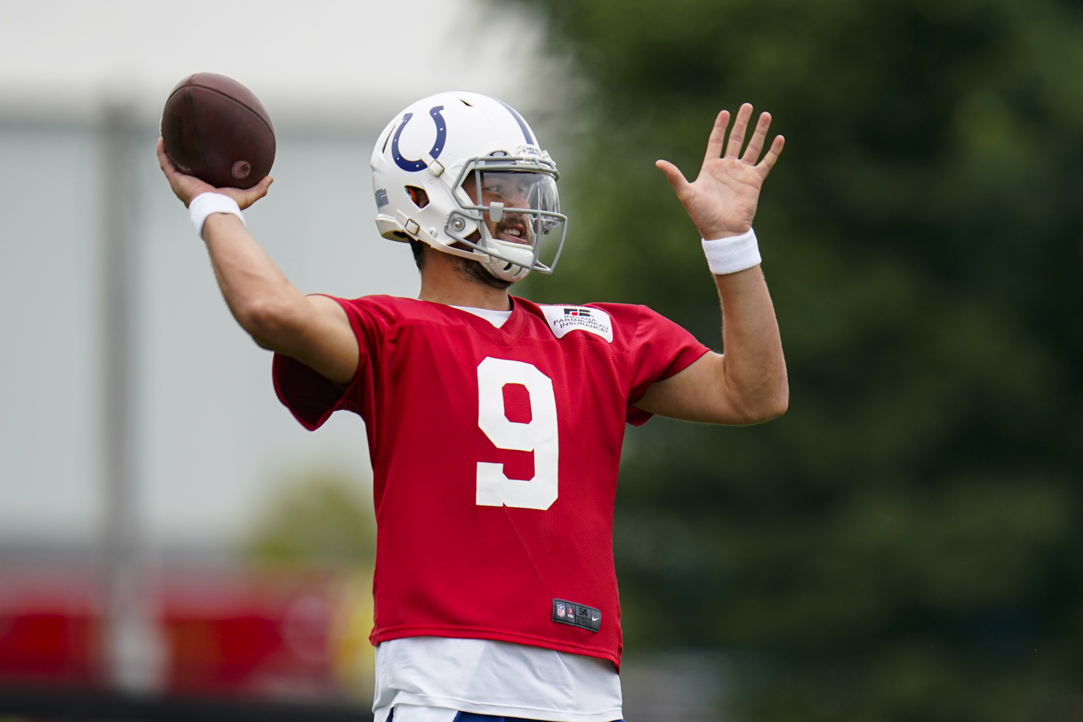 Indianapolis Colts quarterback Jacob Eason (9) warms up on the