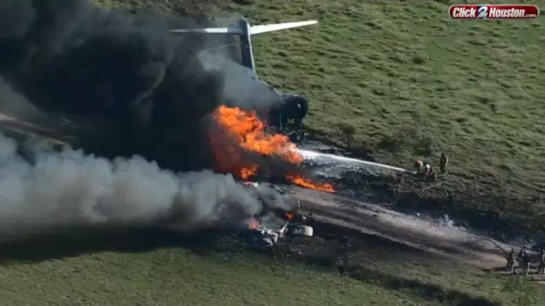 Aerial photos show fiery plane crash near Houston where all 21