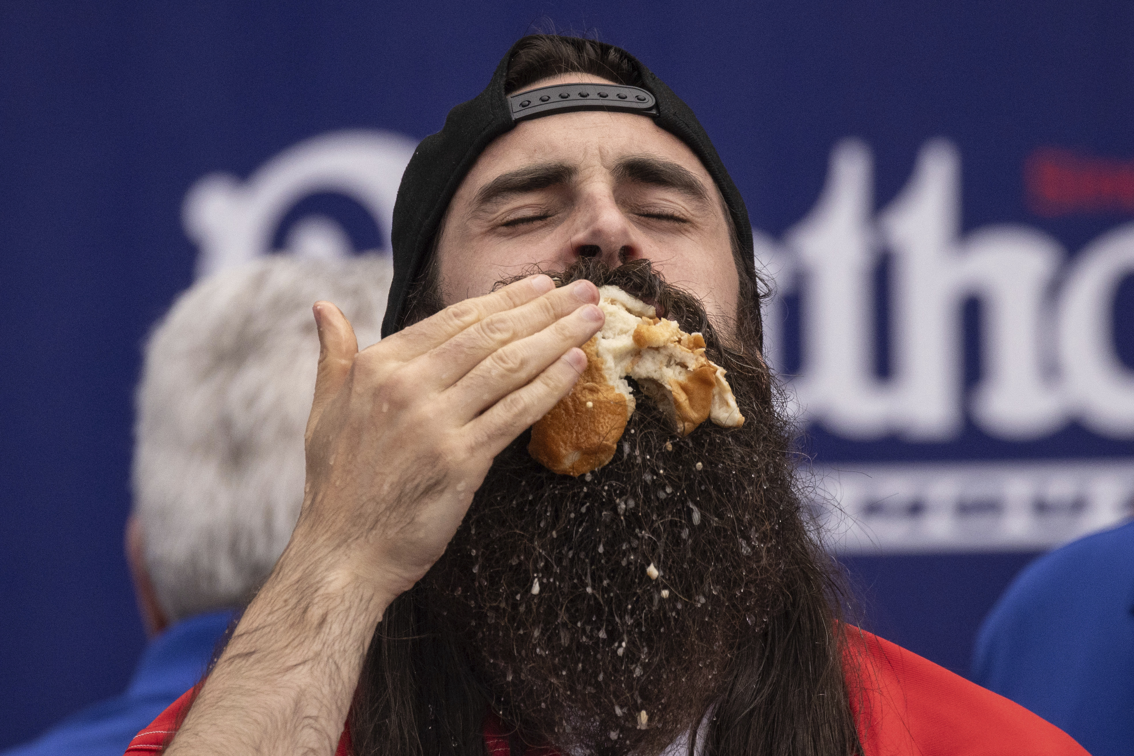 Joey Chestnut shakes off rain delay and defends title at Nathan's