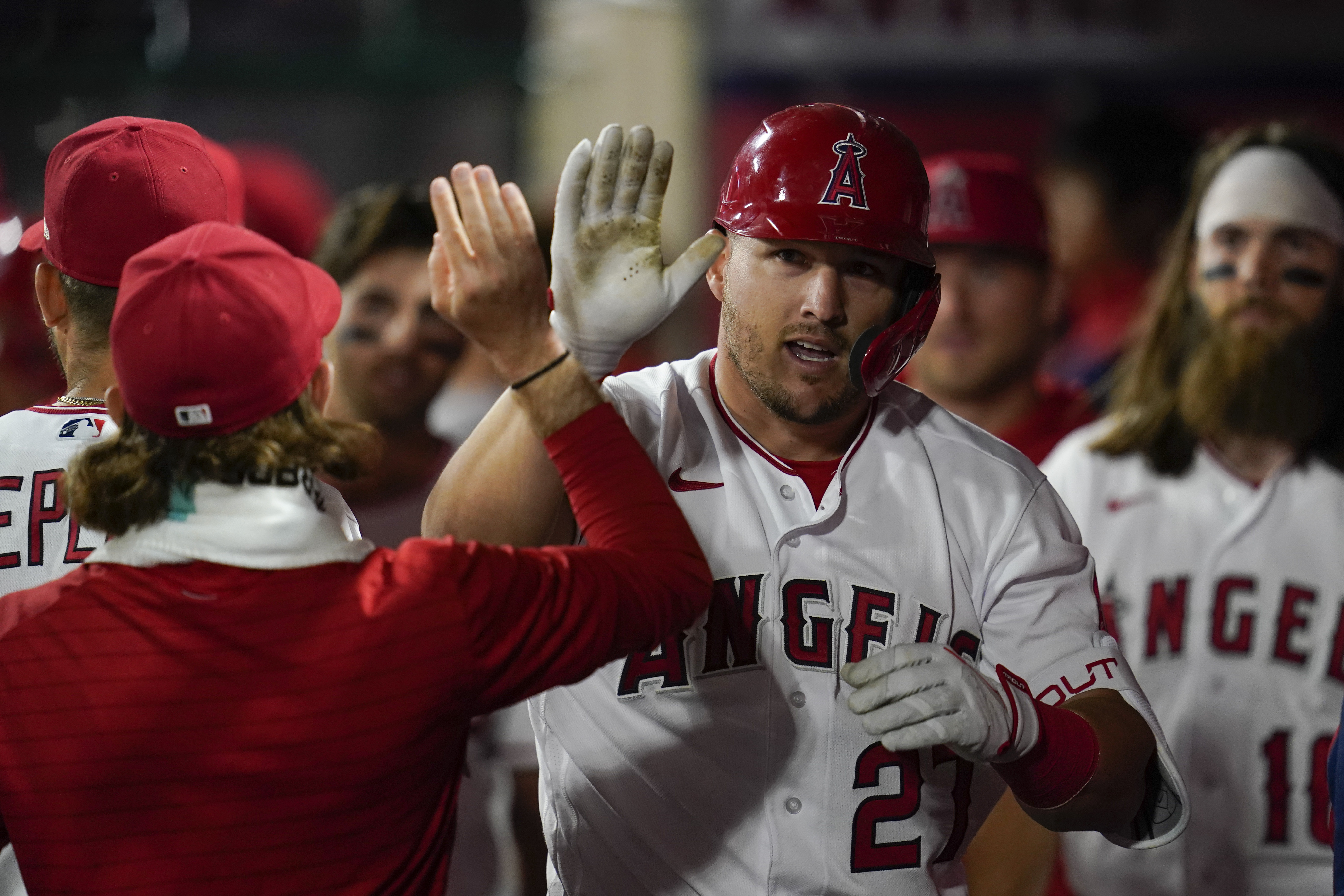 Los Angeles Angels' Mike Trout, right, celebrates his home run