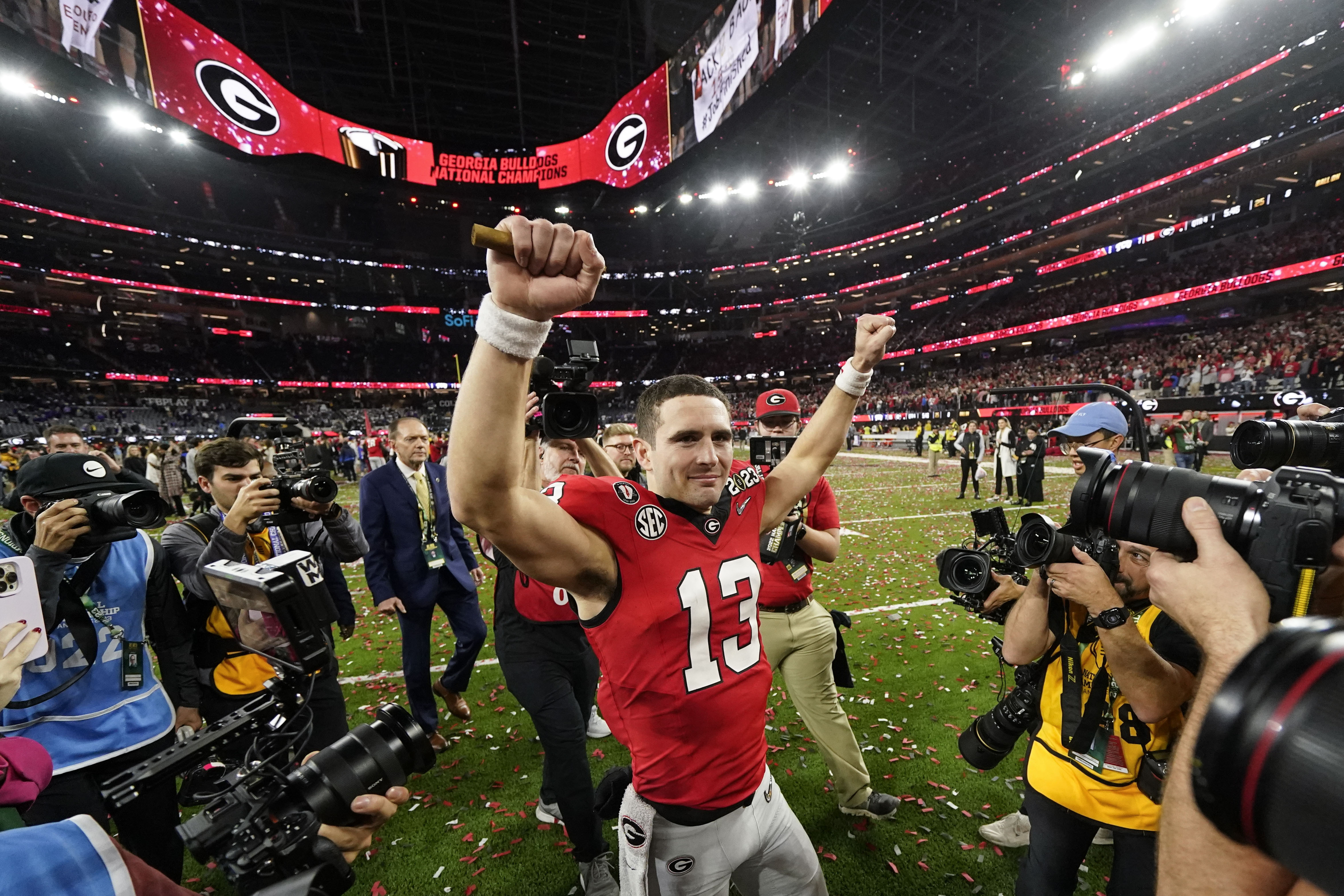 FILE - Georgia tight end Brock Bowers (19) makes a touchdown catch over TCU  safety Abraham Camara (14) during the second half of the national  championship NCAA College Football Playoff game, Monday