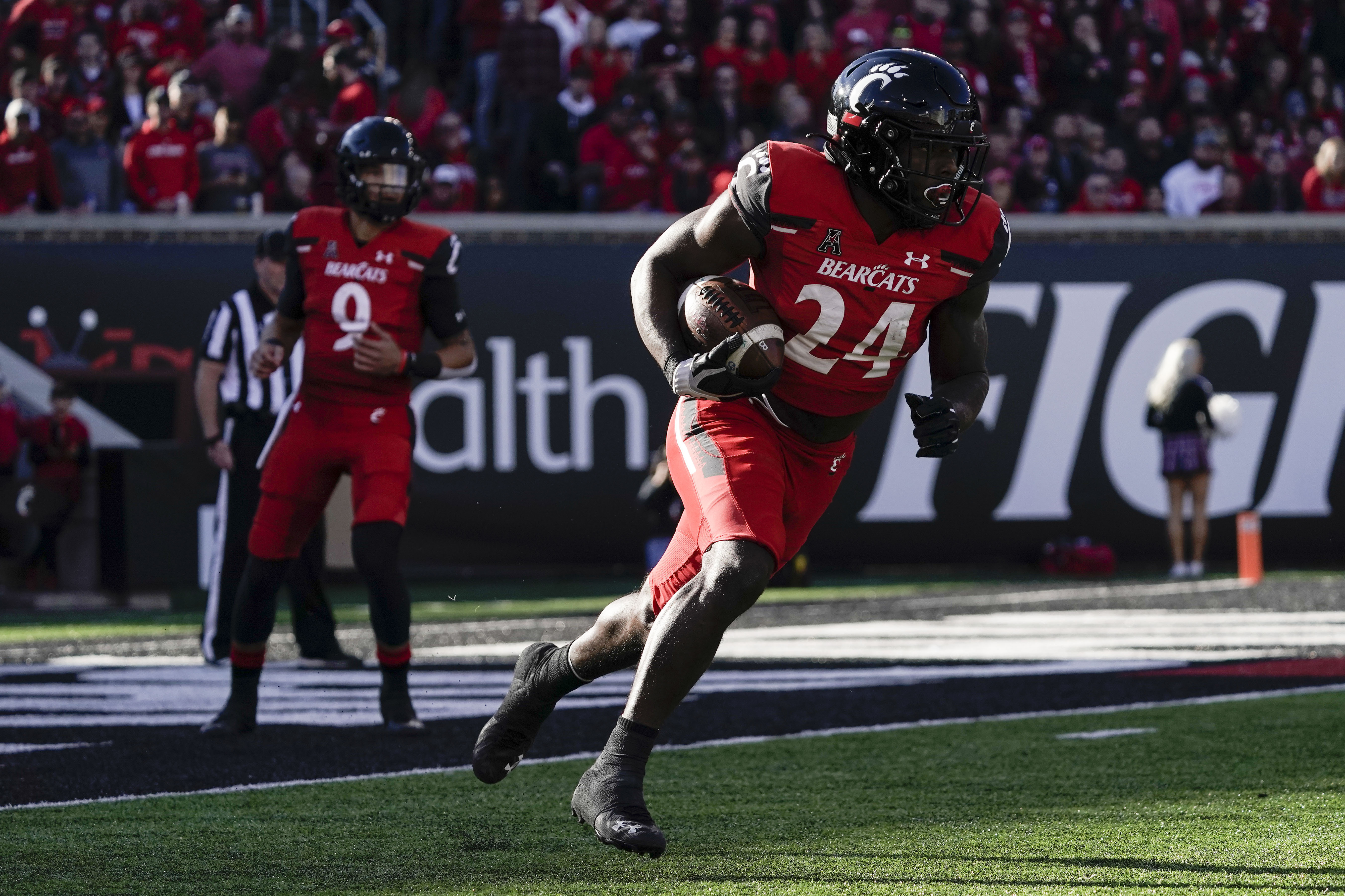 No. 2 Cincinnati holds off Tulsa 28-20 to improve to 9-0