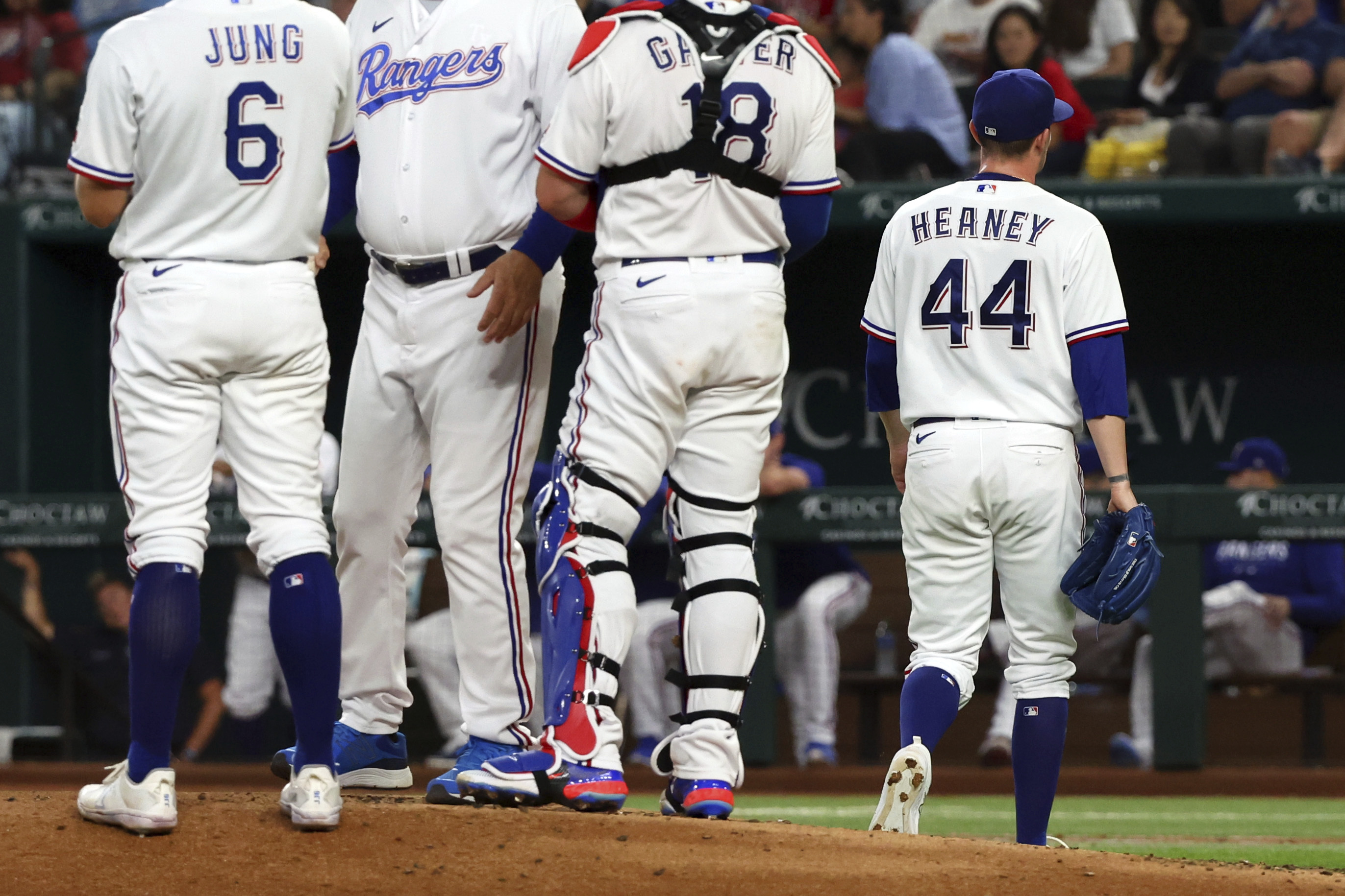 Heaney strikes out 11, Garver and Garcia homer as Rangers beat