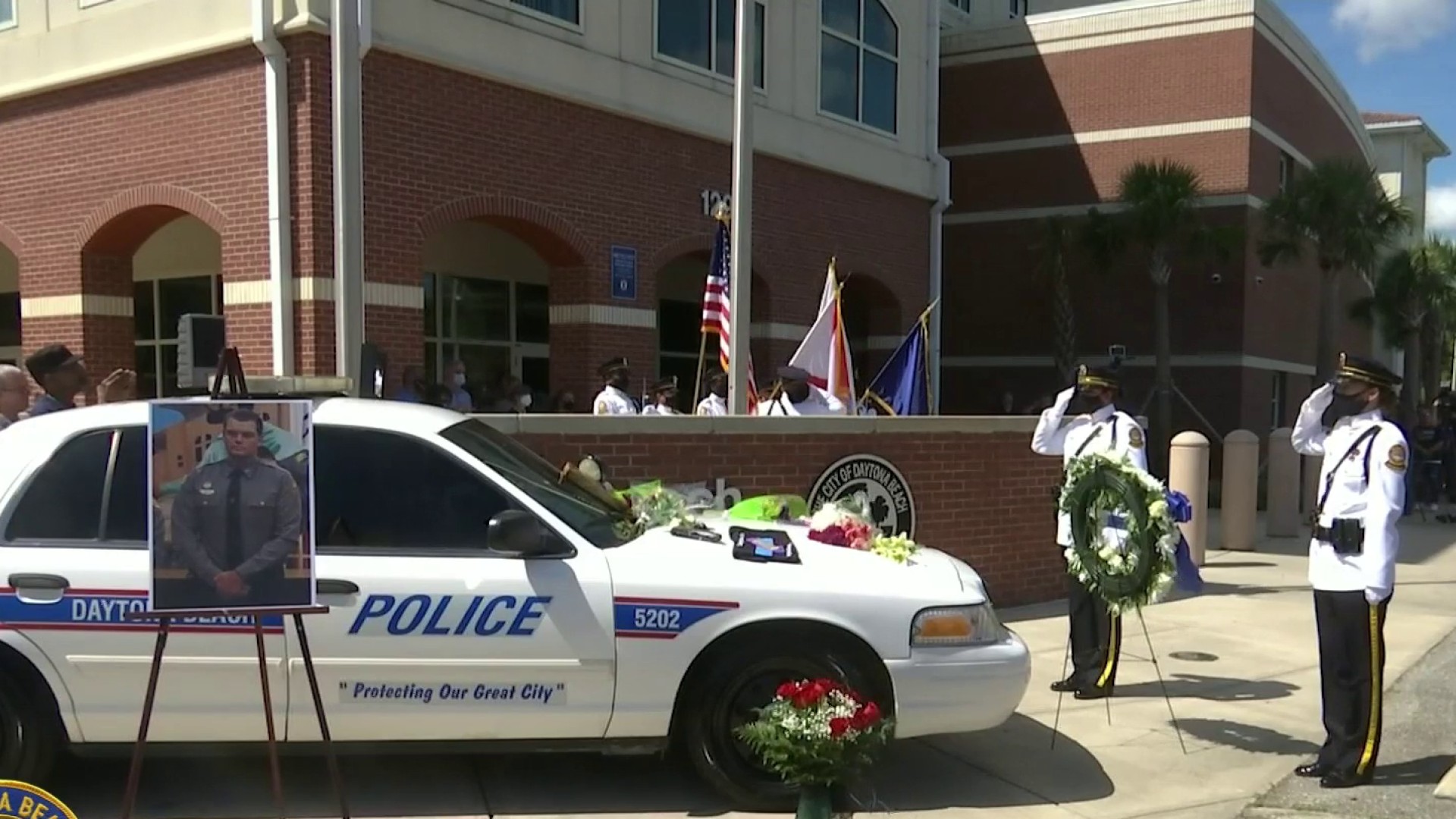 Slain Daytona officer's patrol car signed with messages of honor