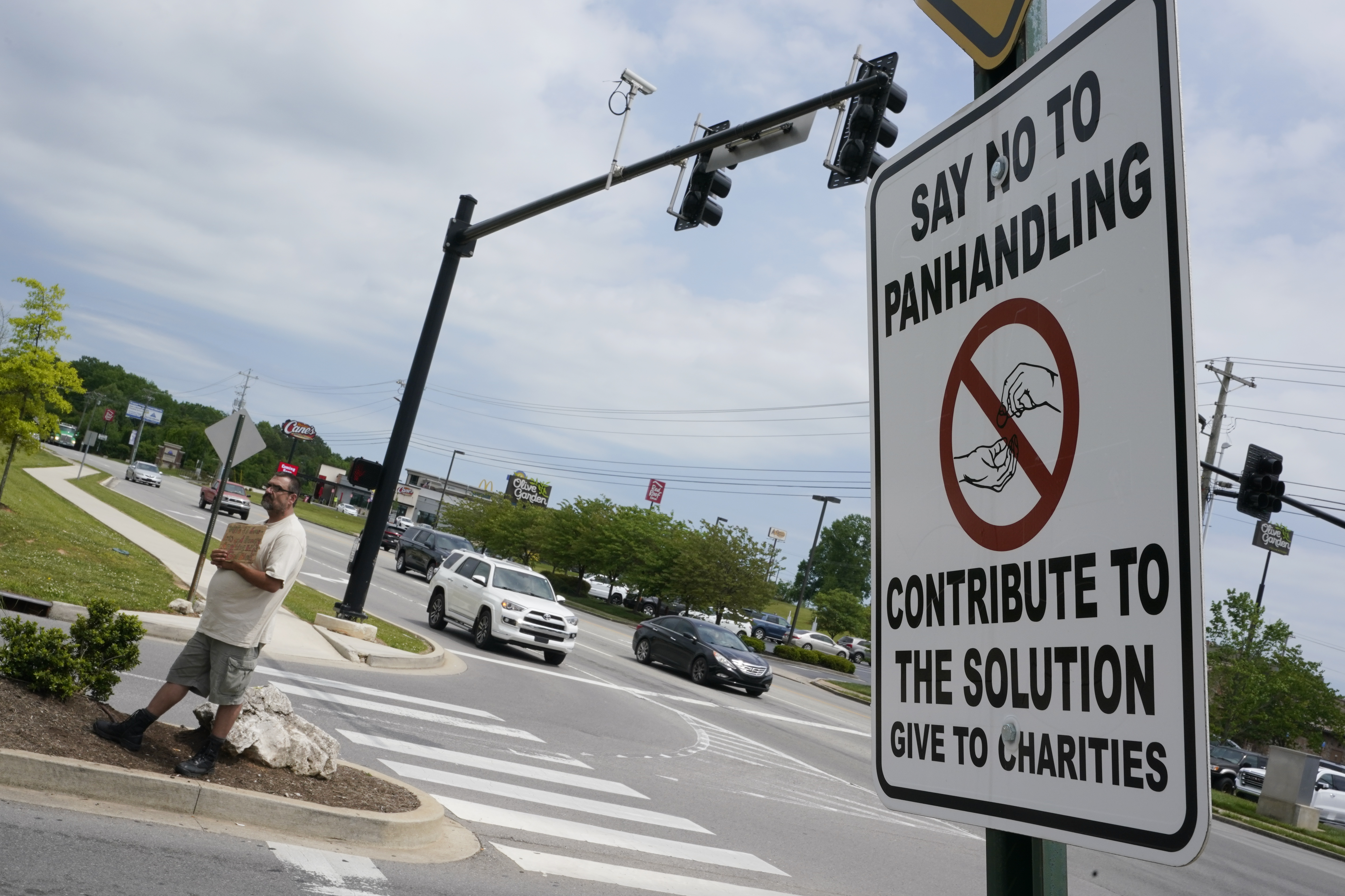 Signs ask drivers give to charity, not panhandlers