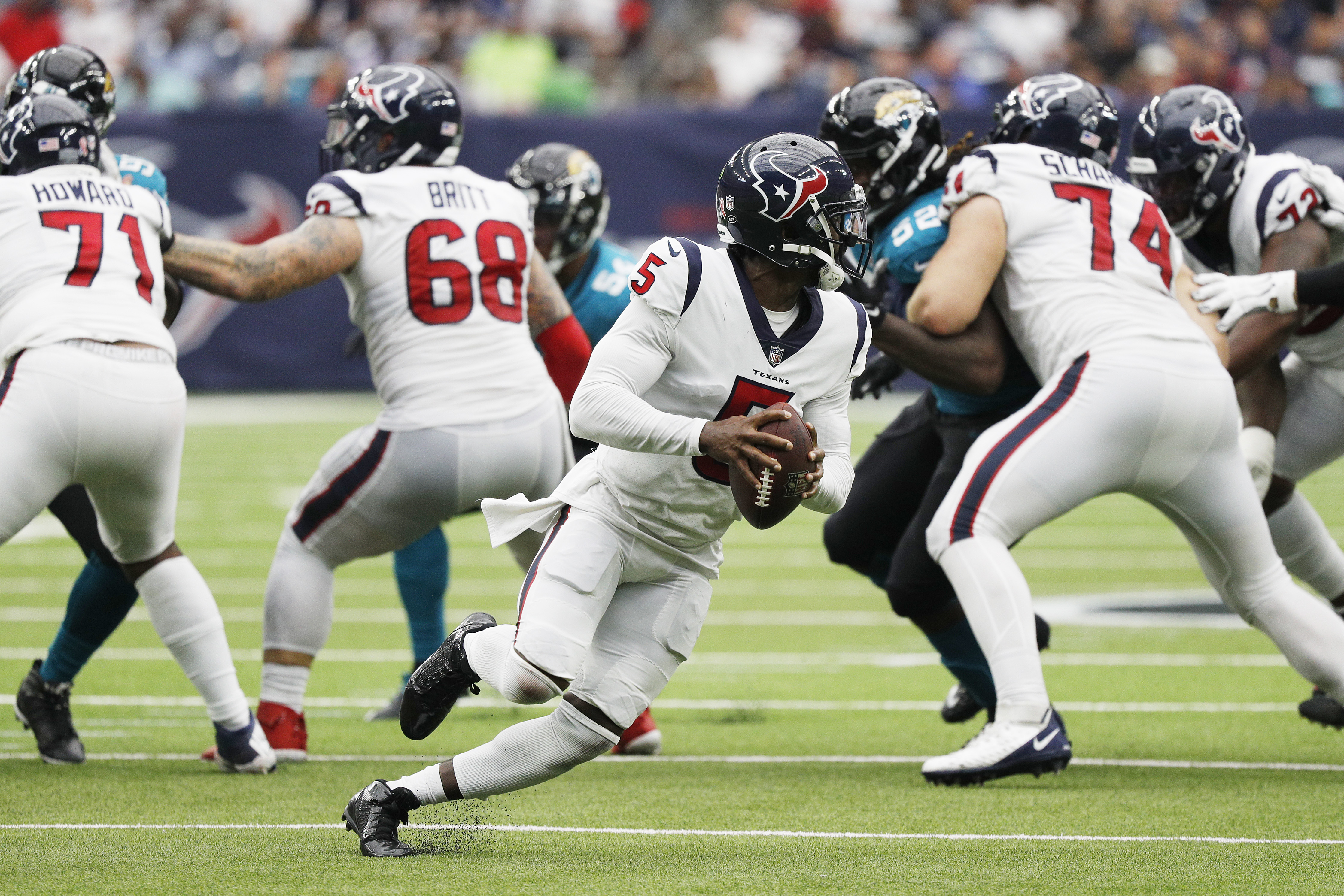 Houston Texans quarterback Tyrod Taylor (5) hands the ball off to Houston  Texans running back Mark Ingram II (2) during the first half of an NFL  football game Sunday, Sept. 12, 2021