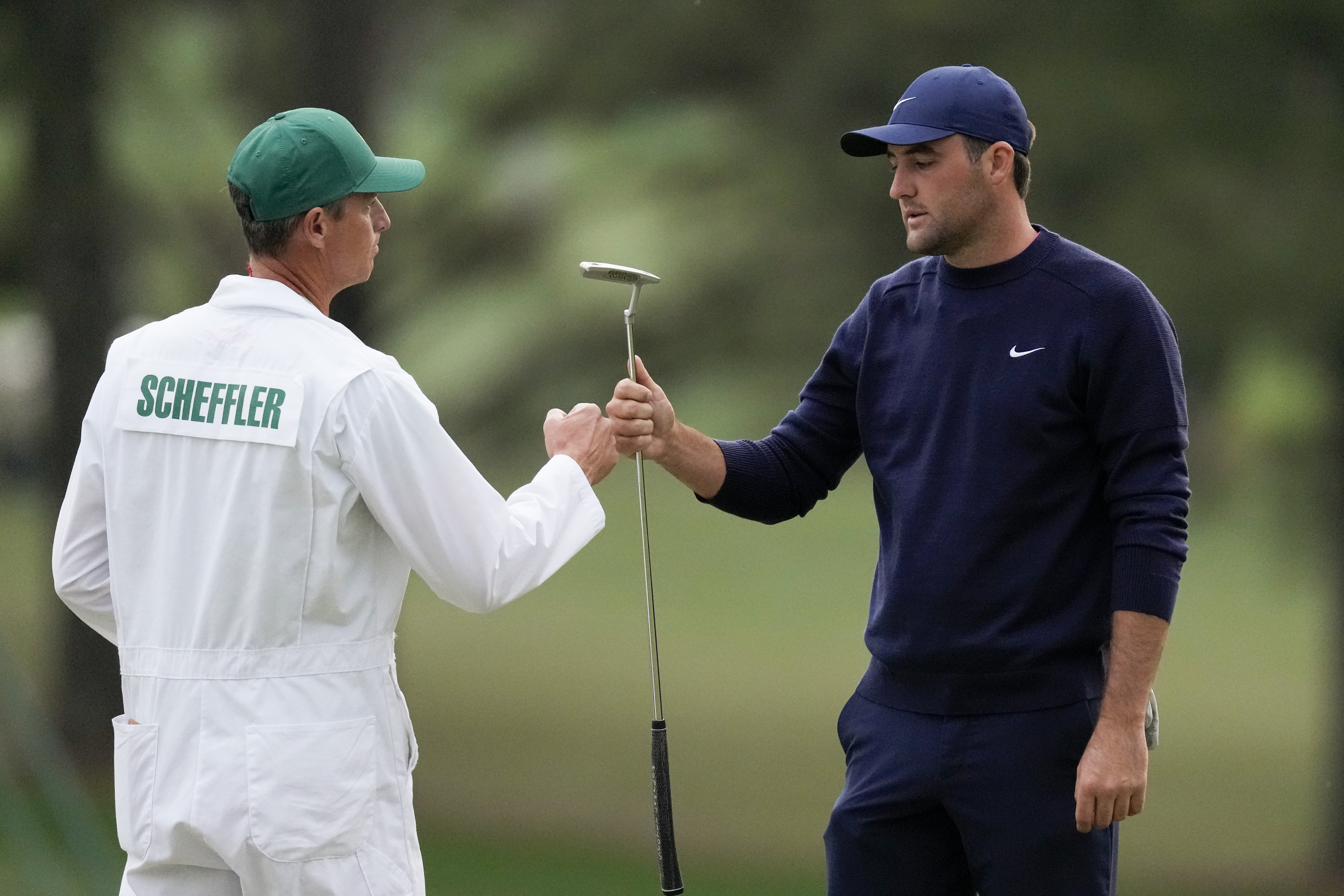 Who is the caddie for Scottie Scheffler?