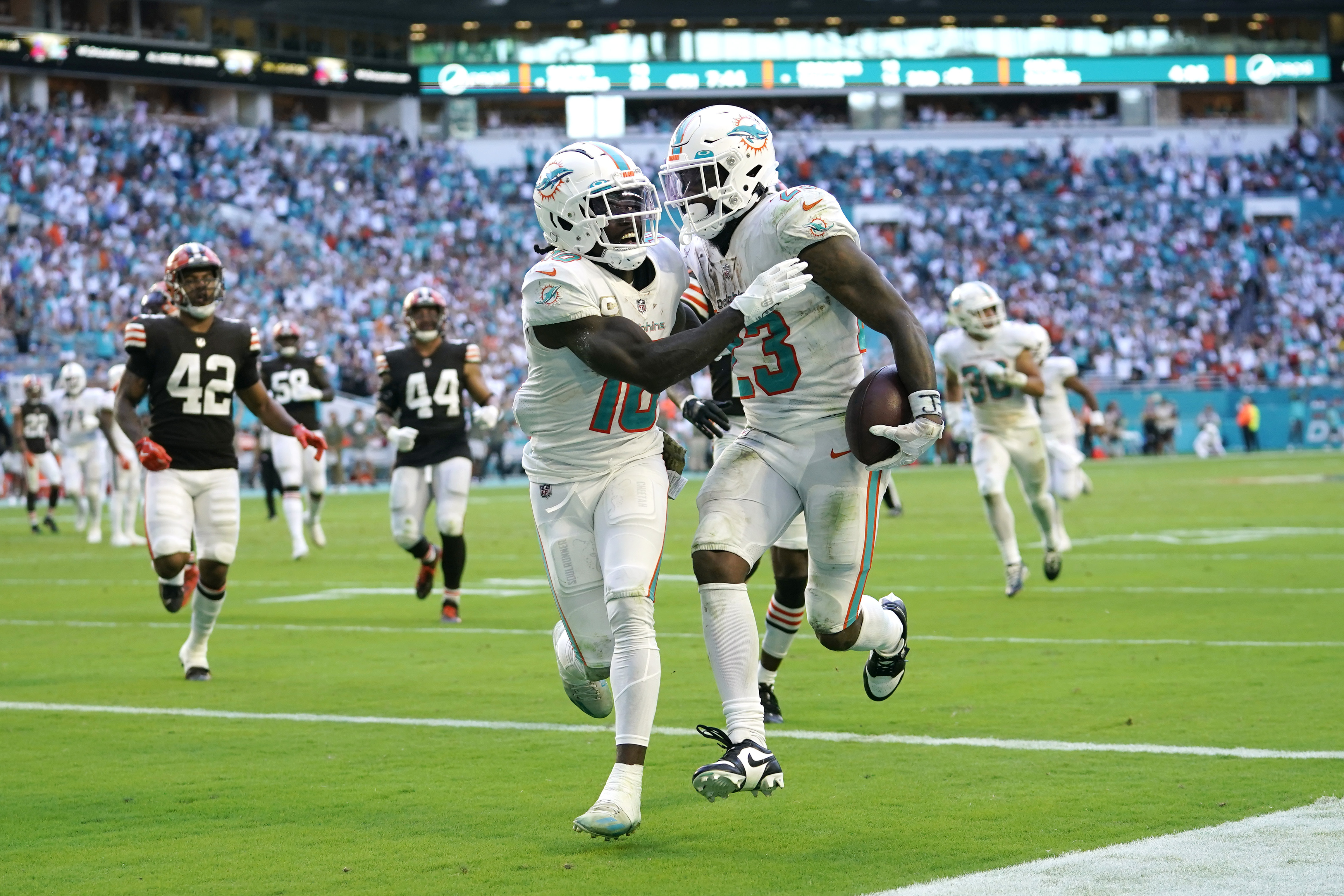 Miami Dolphins wide receivers Jaylen Waddle, right, and Tyreek Hill warm up  before the start of an NFL football game against the Chicago Bears, Sunday,  Nov. 6, 2022 in Chicago. (AP Photo/Charles