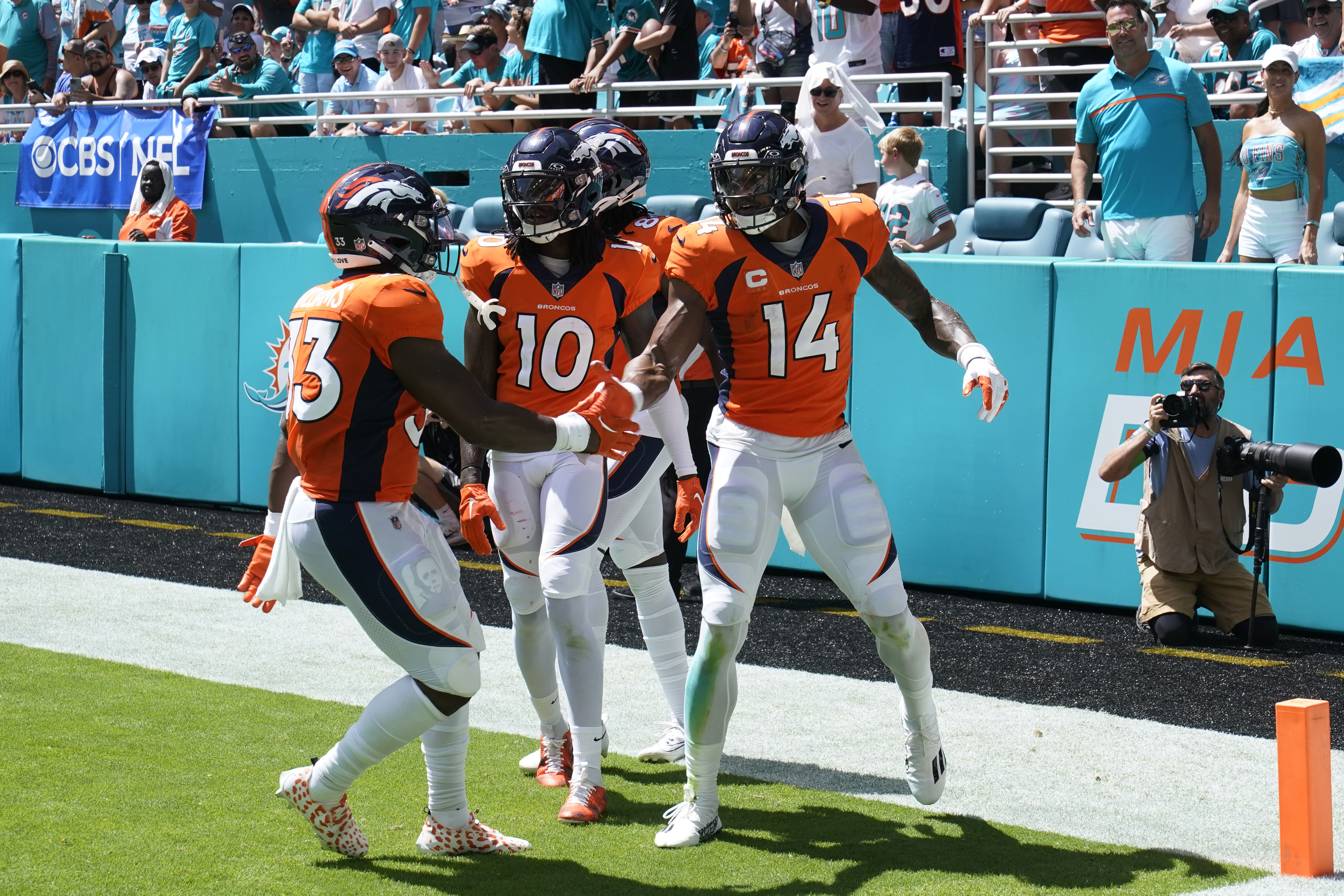 Miami Dolphins running back De'Von Achane (28) scores a touchdown during  the first half of an NFL football game against the Denver Broncos, Sunday,  Sept. 24, 2023, in Miami Gardens, Fla. (AP